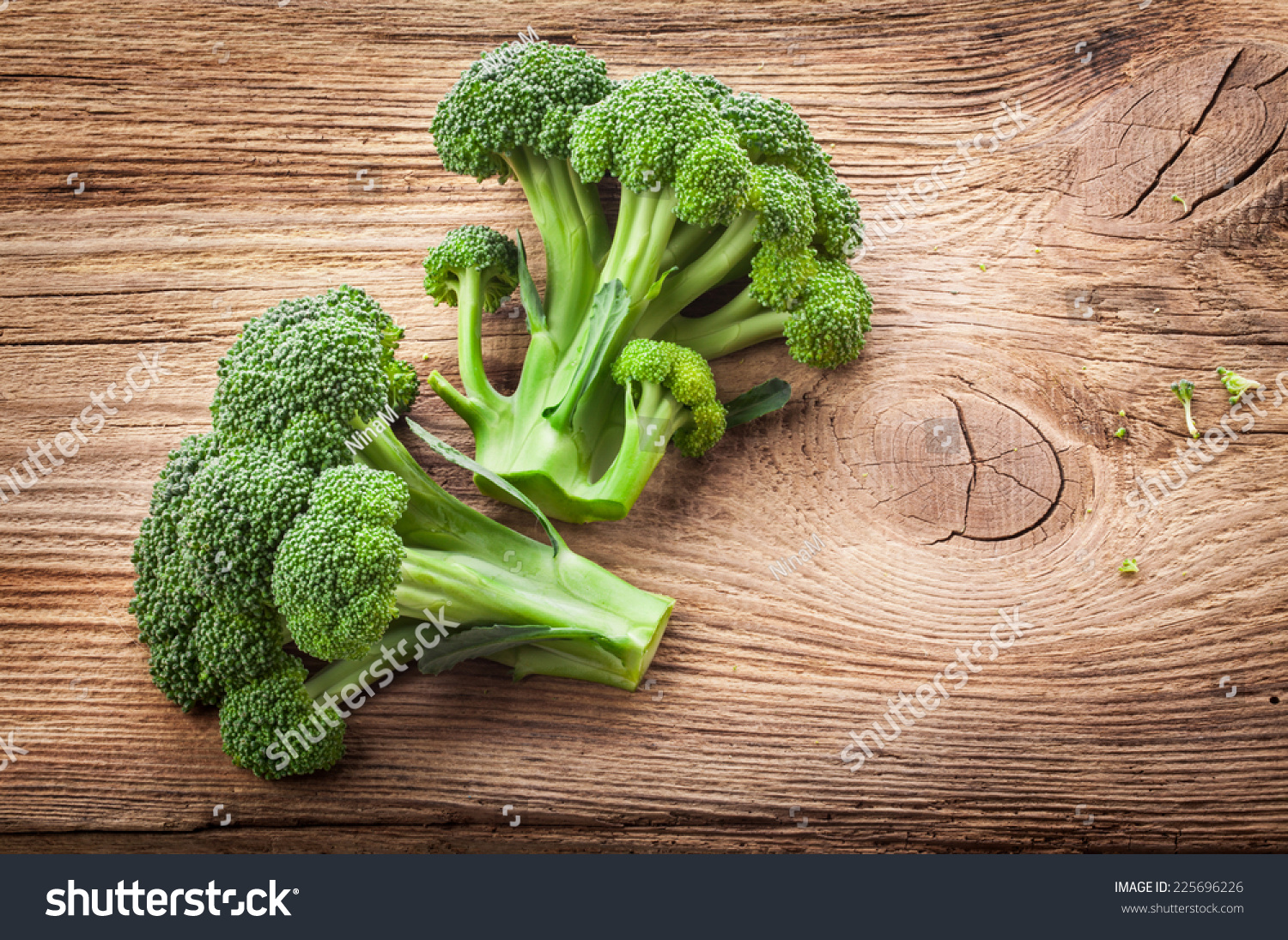 Fresh broccoli on the wooden table #225696226