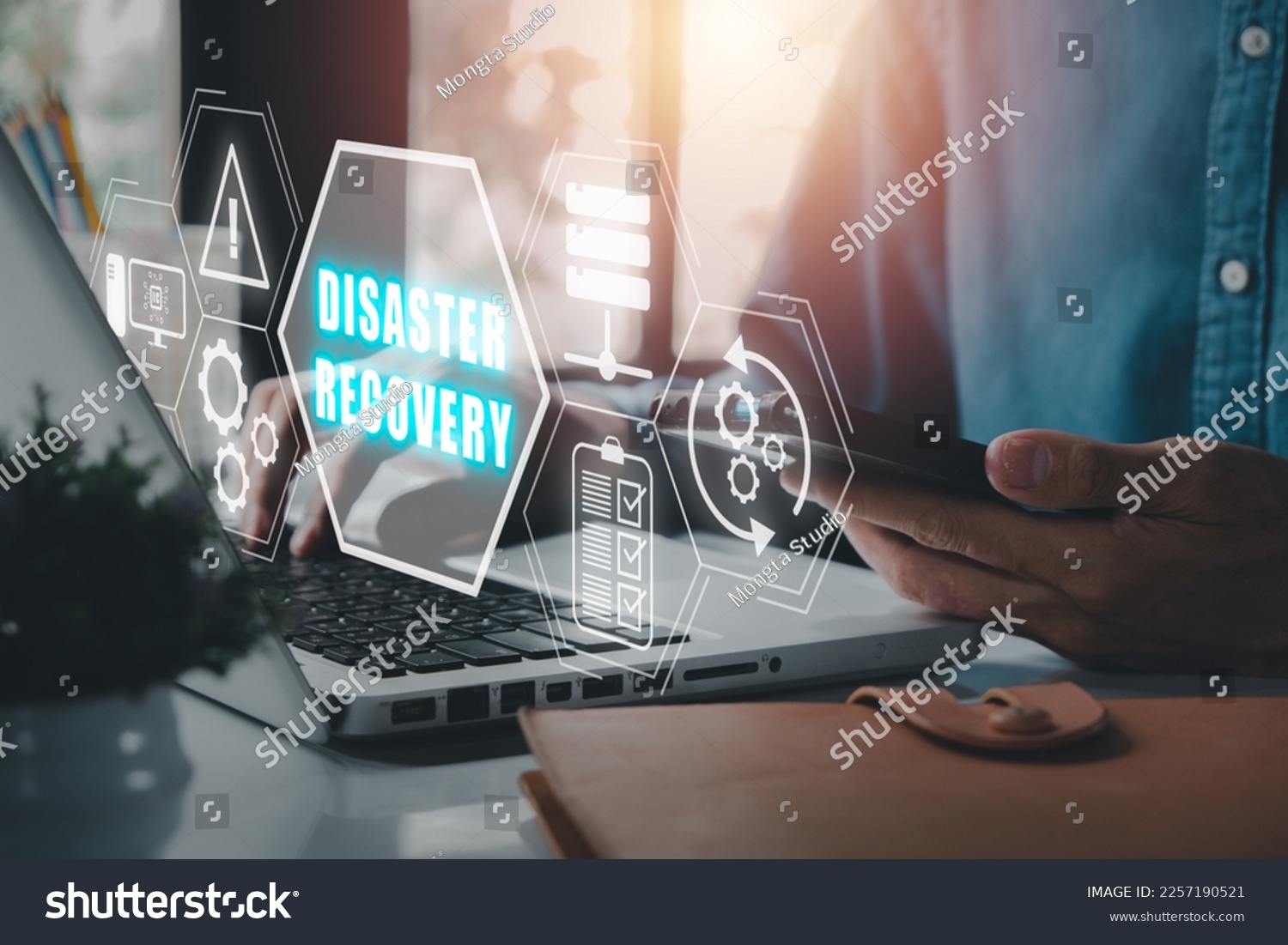 Disaster Recovery concept, Person hand using laptop computer with Disaster Recovery icon on virtual screen. #2257190521