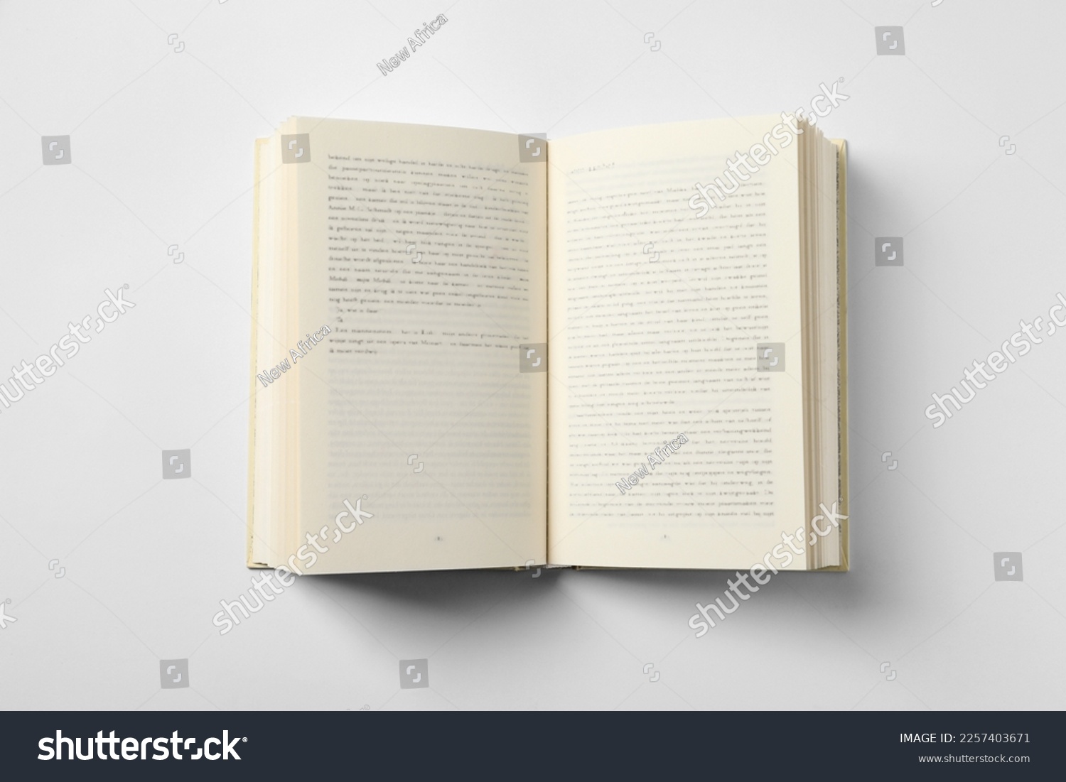 Open book on white background, top view #2257403671