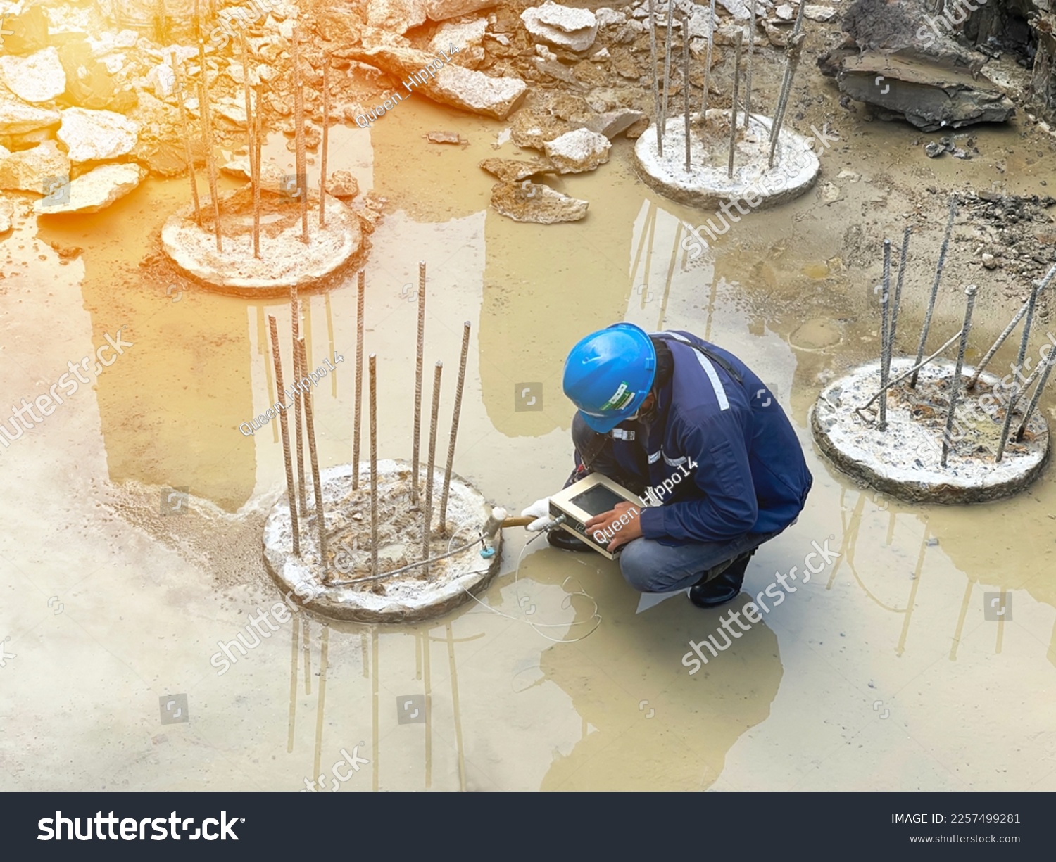 Seismic test on concrete pile.Engineer checking the integrity of the pile.Site construction work #2257499281
