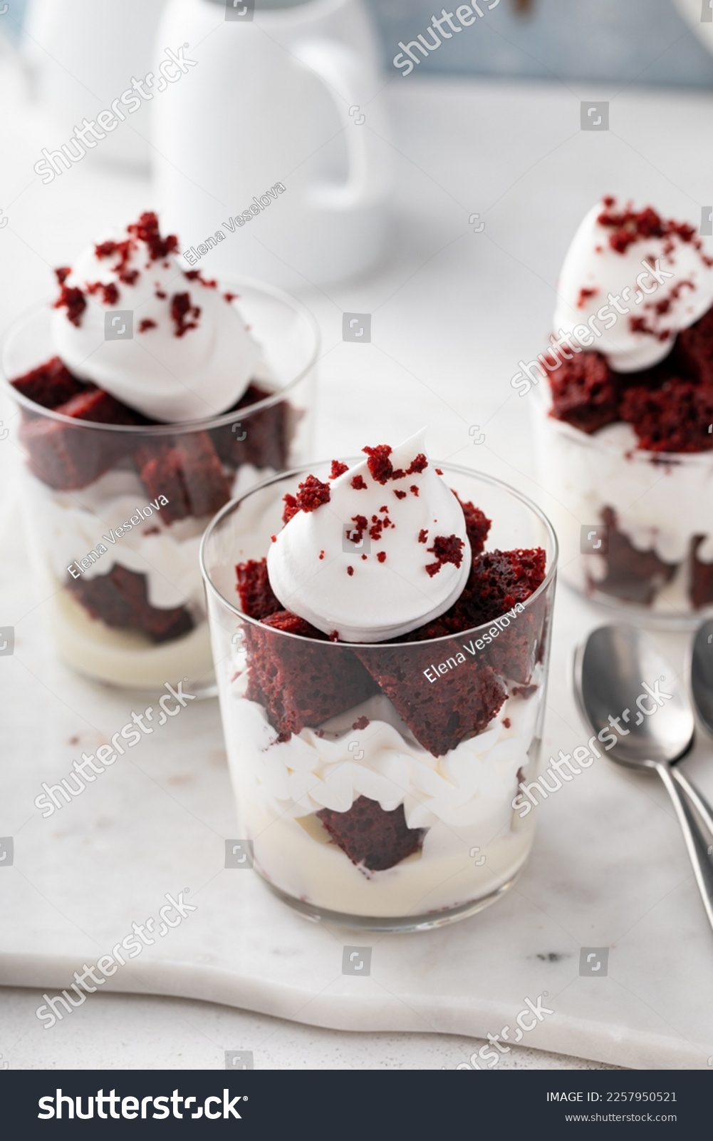 Red velvet trifle or parfait with cream cheese mousse and whipped cream, dessert in a glass idea #2257950521