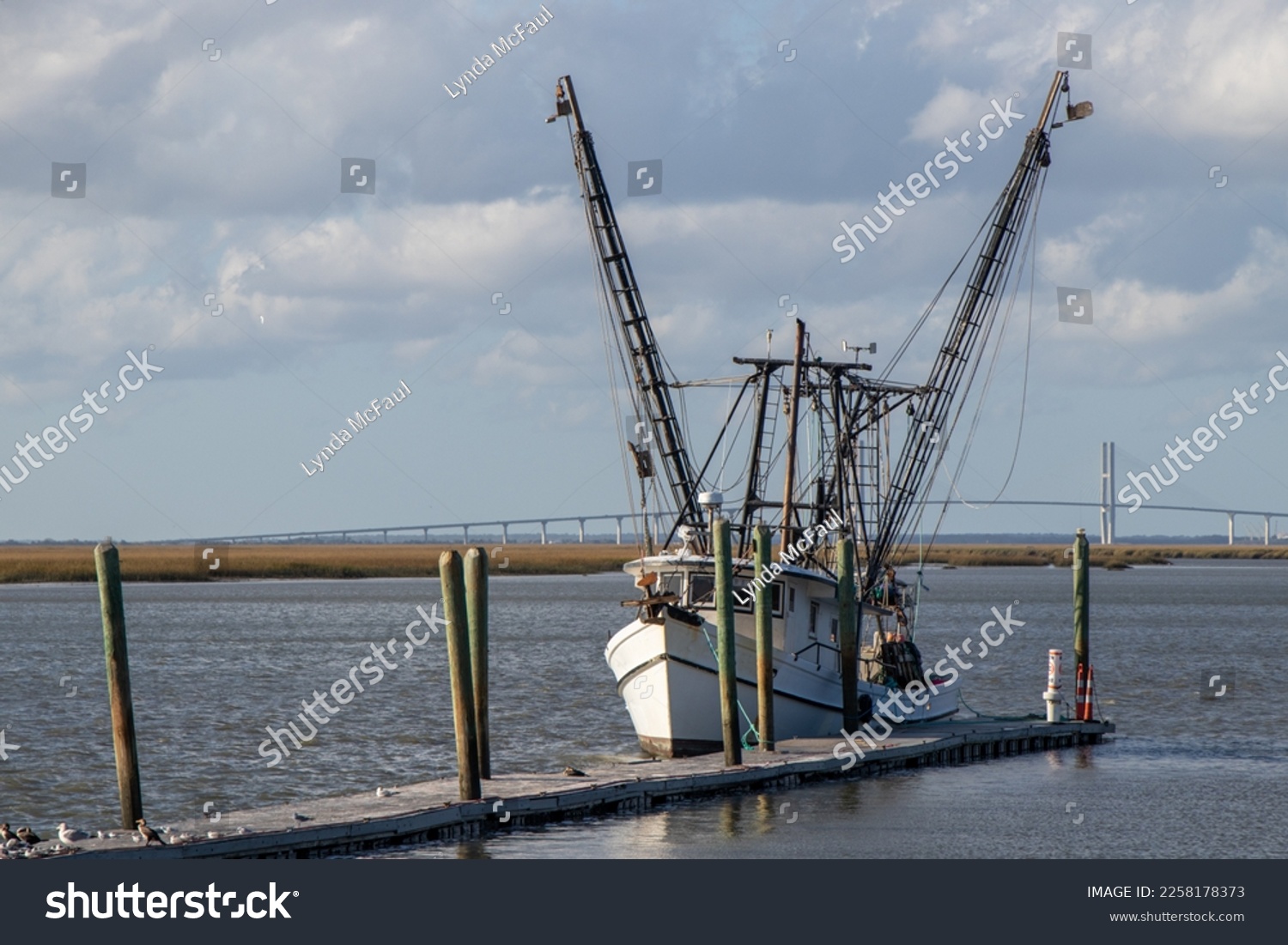 Commercial fishing vessel moored at a dock on the Intracoastal Waterway in Georgia #2258178373