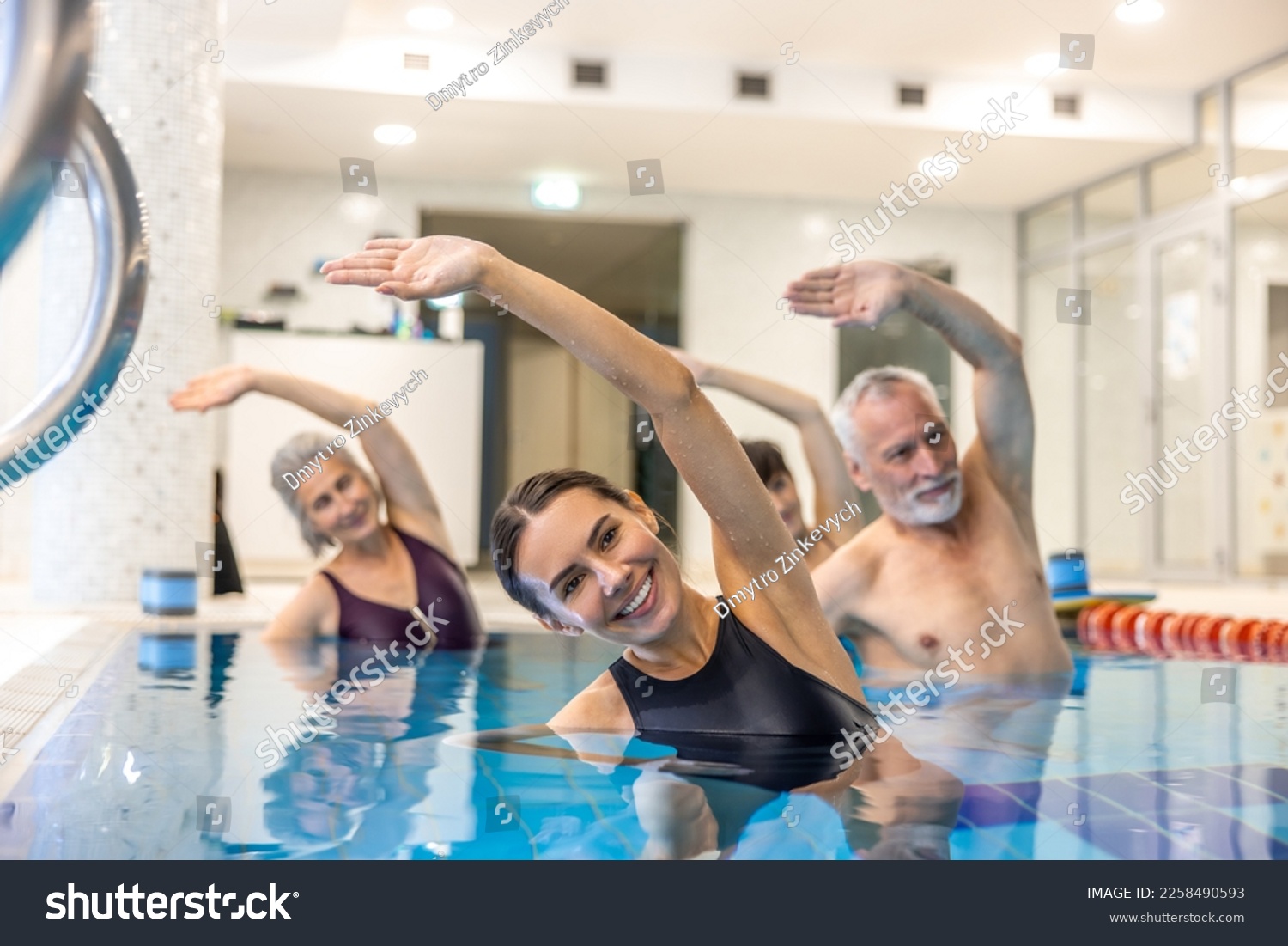 Senior adults in the swimming pool during aqua aerobics class #2258490593