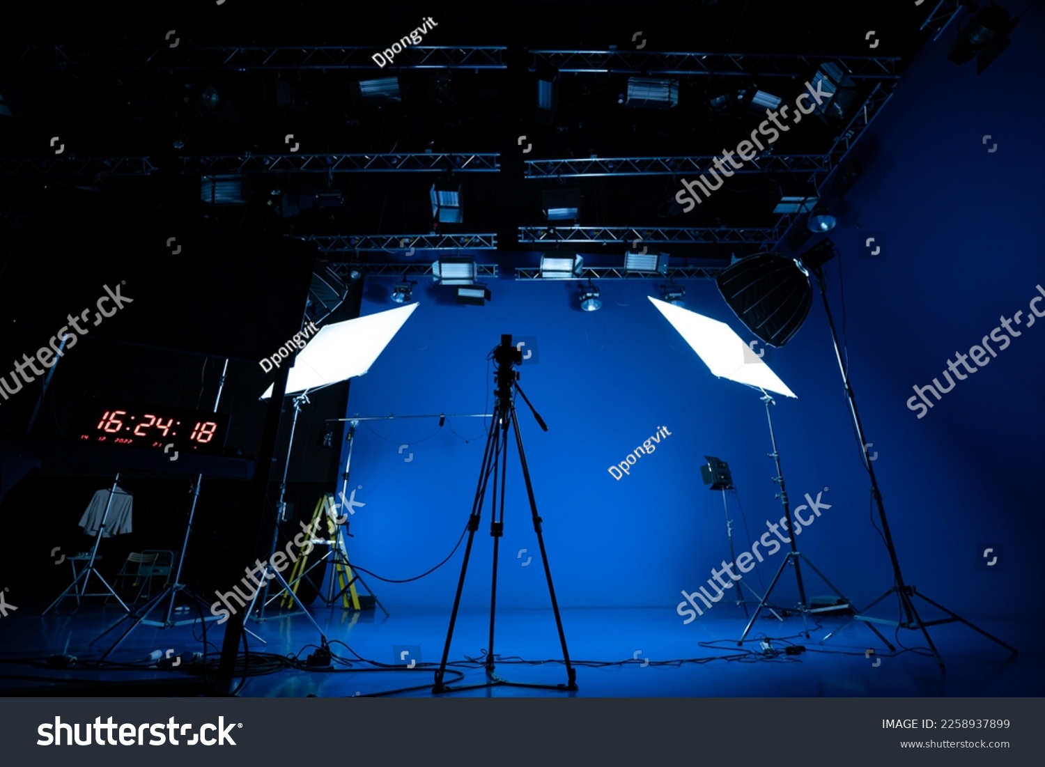 Professional video studio behind-the-scenes video footage behind-the-scenes silhouette production photography with a focus on camera and studio equipment. #2258937899