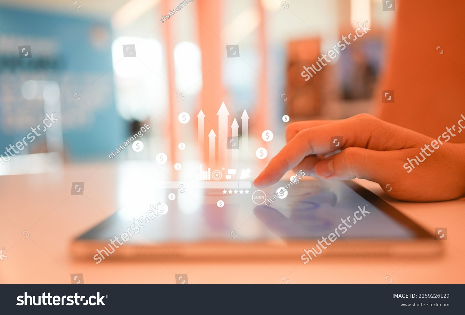 close up businessman hand touch screen on digital tablet to use marketing tool and check traffic research of pay per click program on web page for online b2b business and lifestyle concept #2259226129