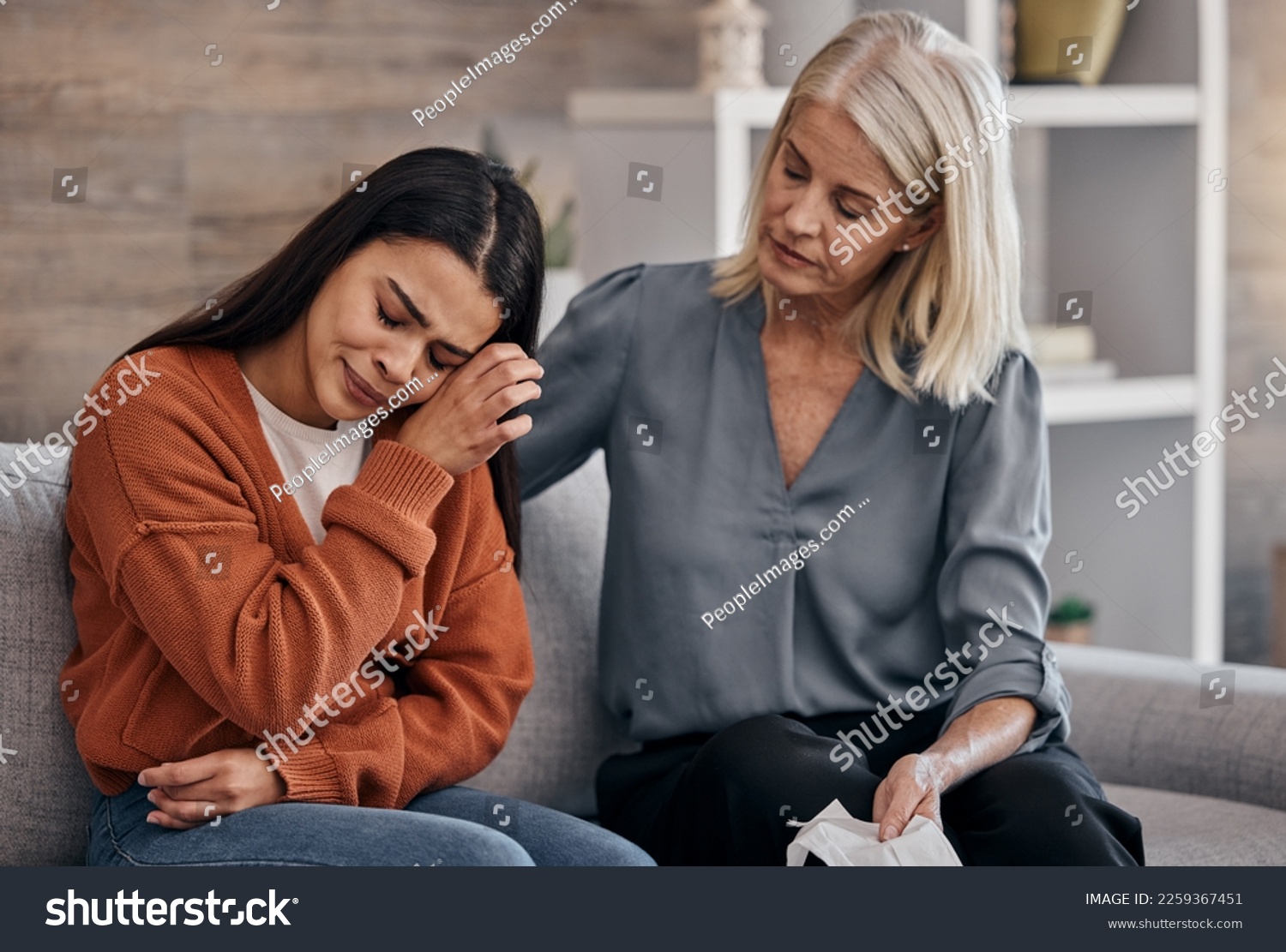 Sad woman, therapist and care for understanding in support for addiction, mental health or counseling. Female counselor or shrink helping crying patient in healthcare, therapy session or meeting #2259367451
