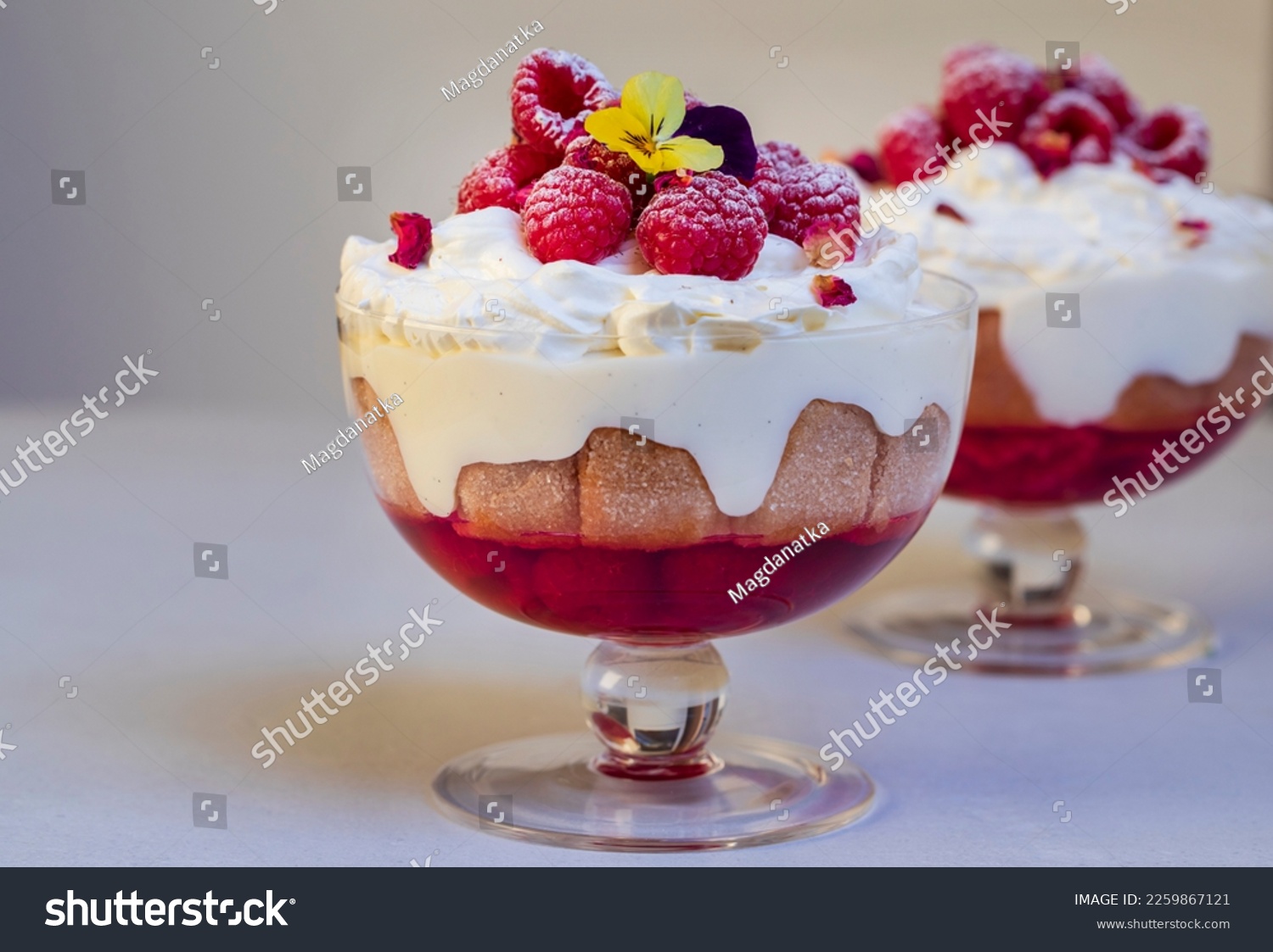 Raspberry trifle with fruit jelly, custard and cream #2259867121