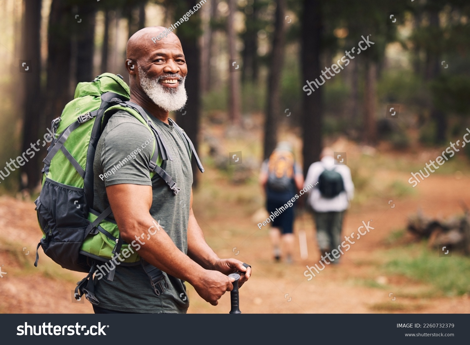Portrait, black man and hiking in forest, exercise and fitness for wellness, healthy lifestyle and smile. Face, senior male and mature gentleman with backpack, smile and hiker in woods and fresh air #2260732379