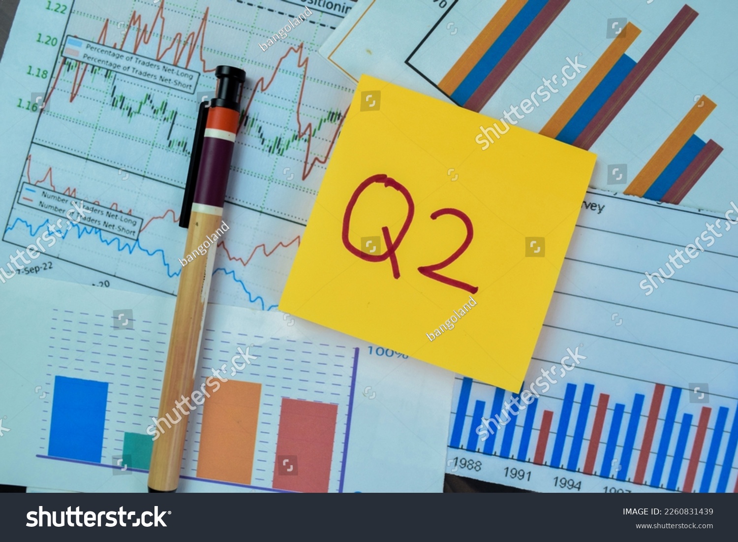Concept of Q2 - 2nd Quarter Period write on sticky notes isolated on Wooden Table. #2260831439