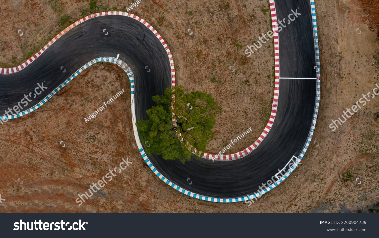 Aerial top view motorsport race asphalt circuit motor racing track, Race track, Curving race track view from above, Aerial view car race asphalt track and curve. #2260904739