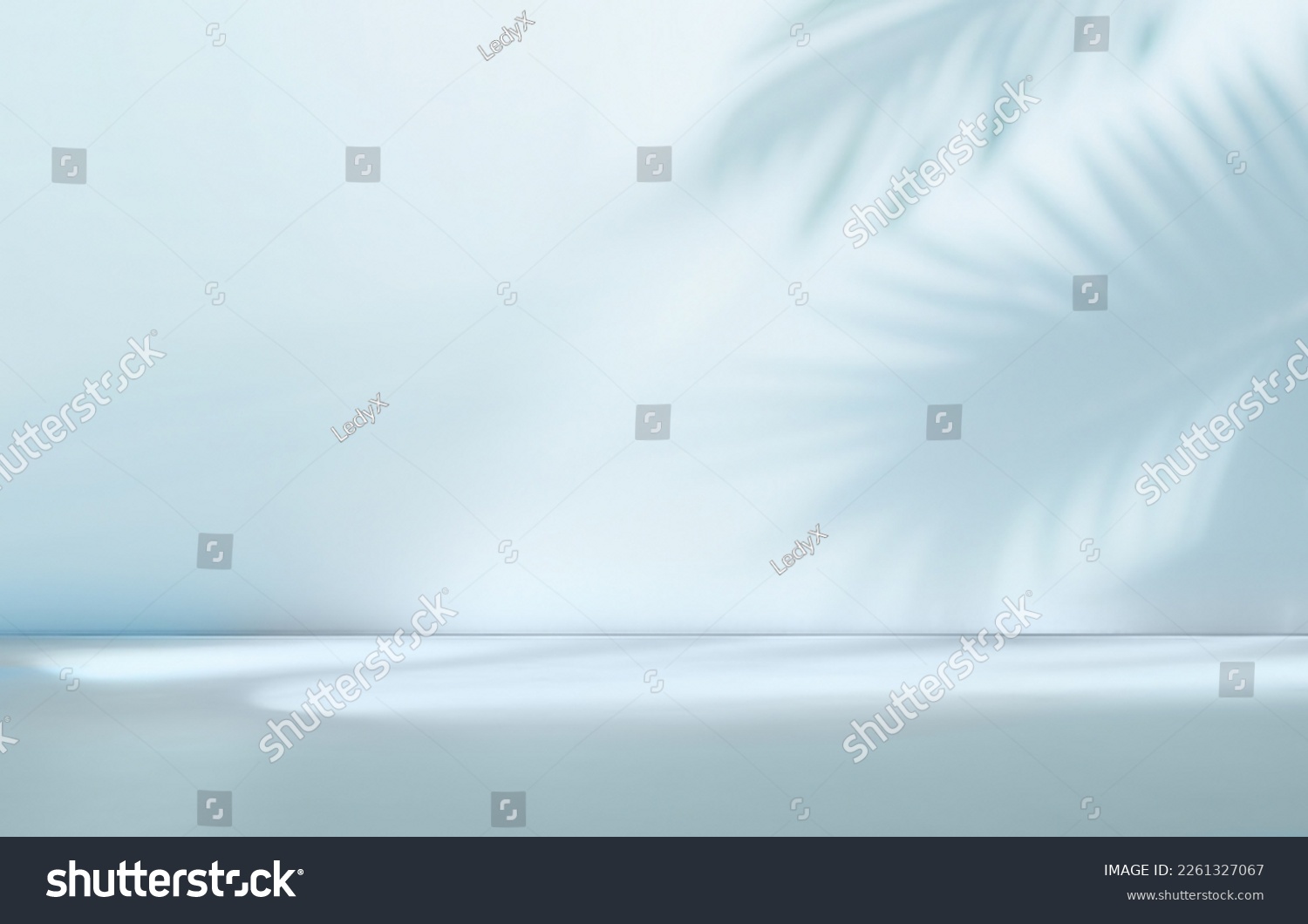 Blurred shadow from palm leaves on the light blue wall. Minimal abstract background for product presentation. Spring and summer. #2261327067