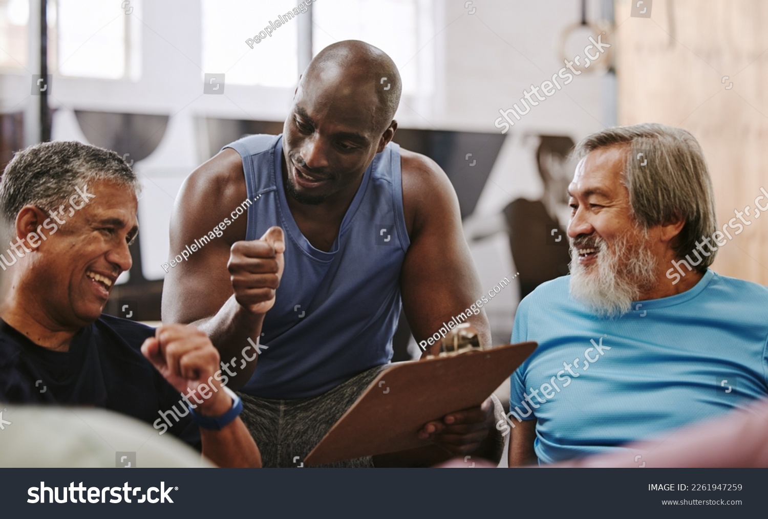 Gym, membership and personal trainer with men for sign up, planning and workout routine on blurred background. Health, checklist and coach with old people on floor for training, goals and motivation #2261947259