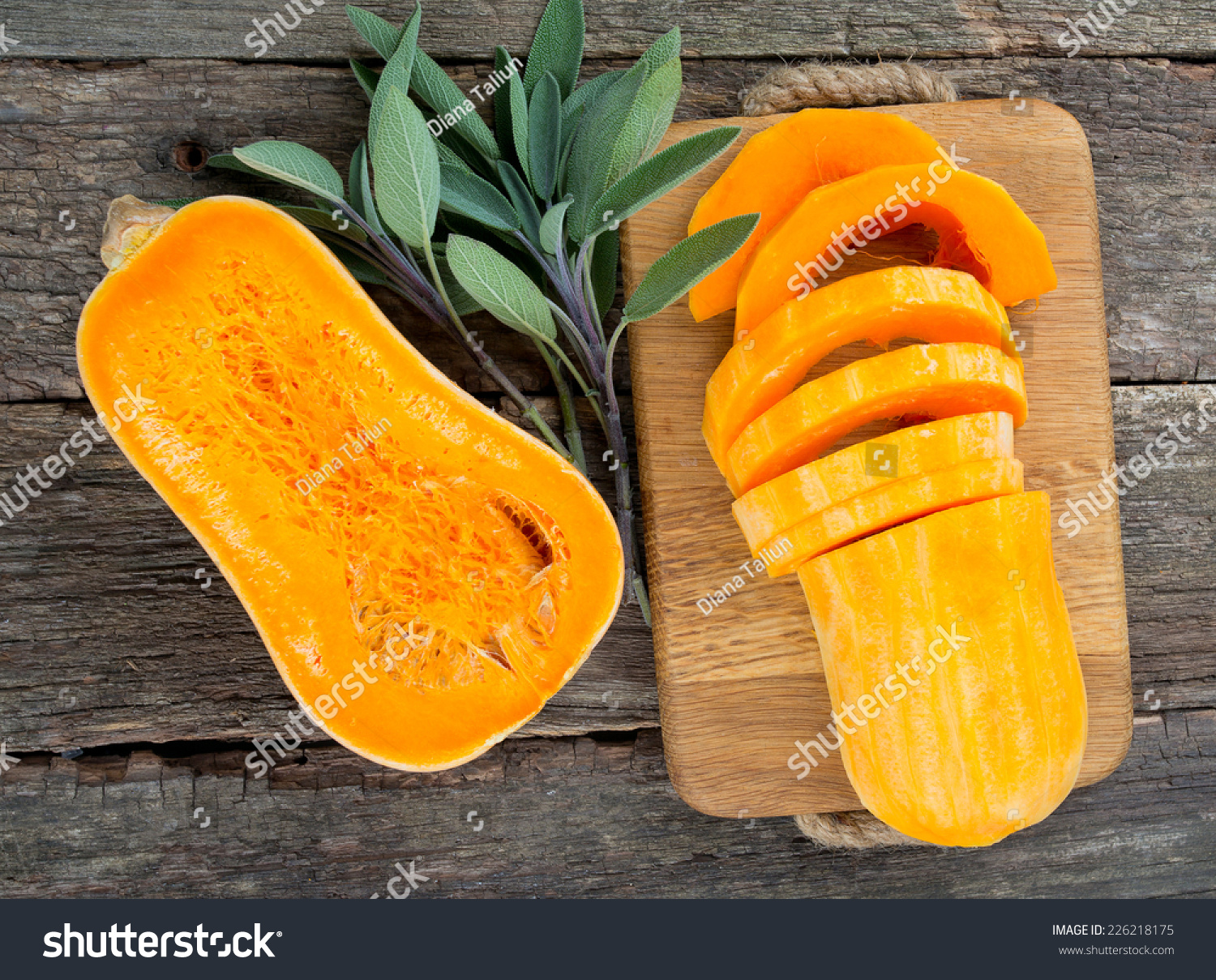 butternut squash over old wood background #226218175