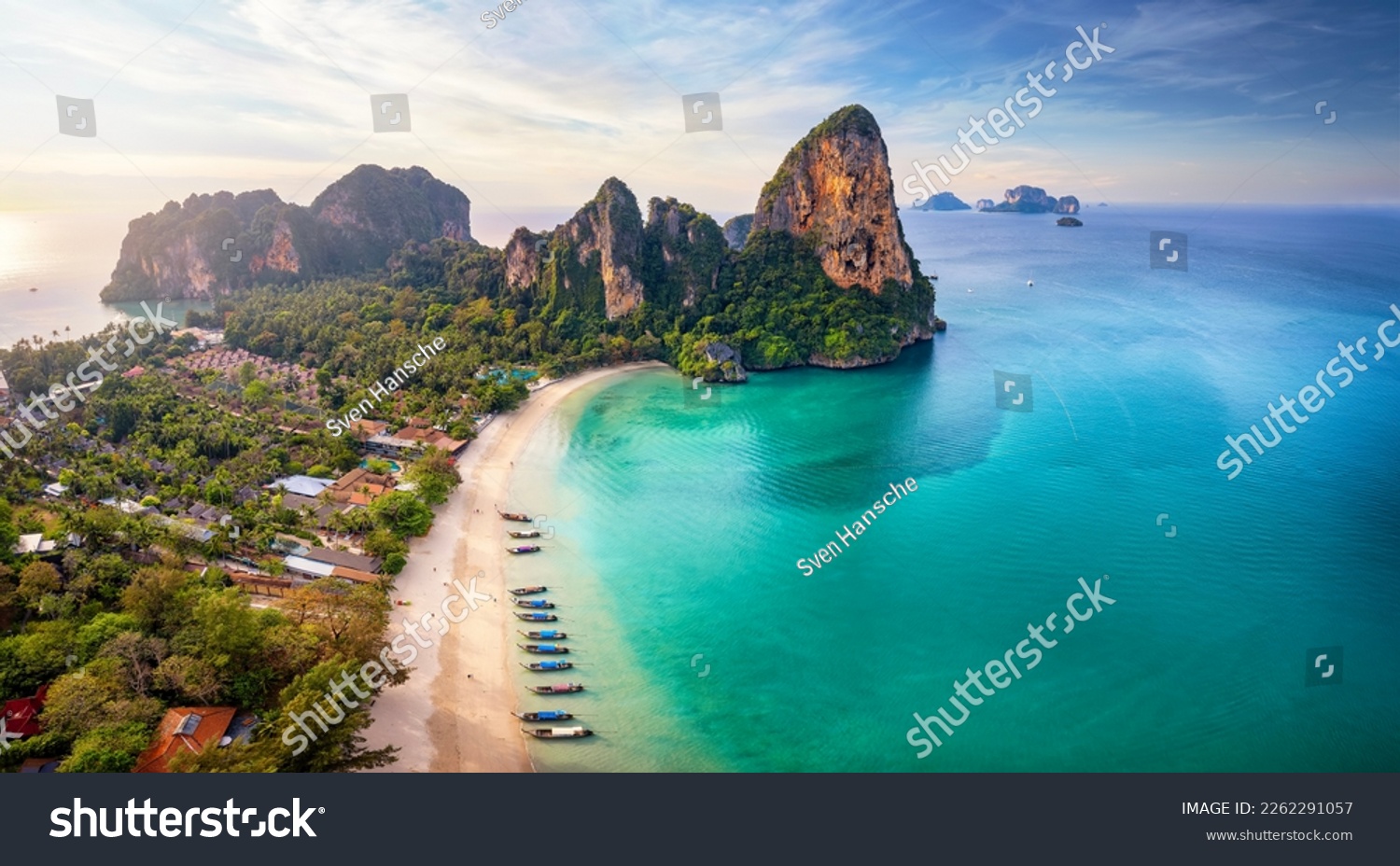 Panoramic aerial view of the beautiful Railay beach, Krabi, Thailand, lush rain forest and emerald sea during morning sunrise without people #2262291057