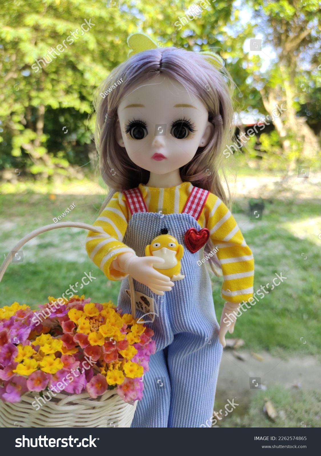 uci Barbie picking beautiful lamtana flowers in the yard #2262574865