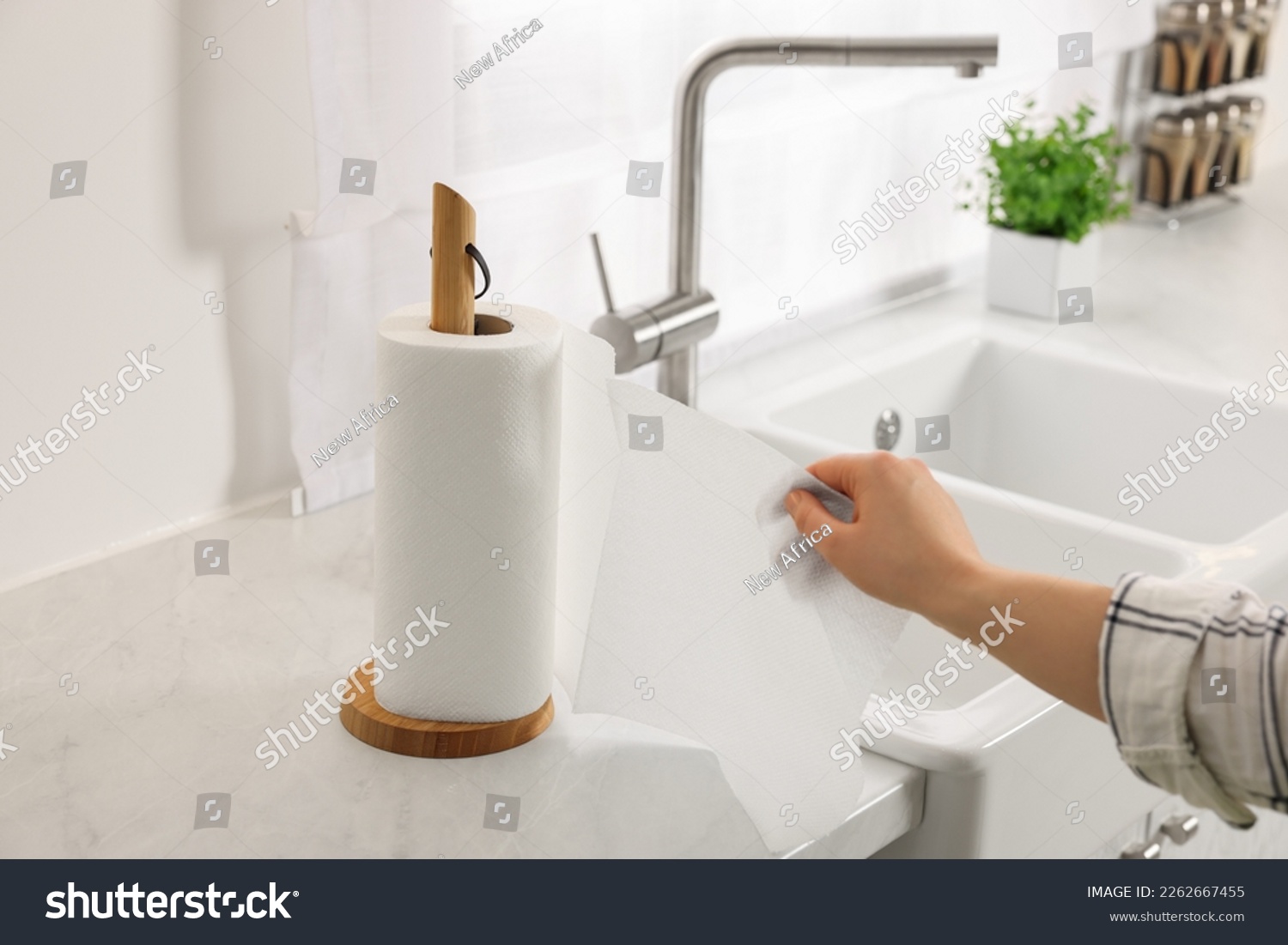Woman using paper towels in kitchen, closeup #2262667455