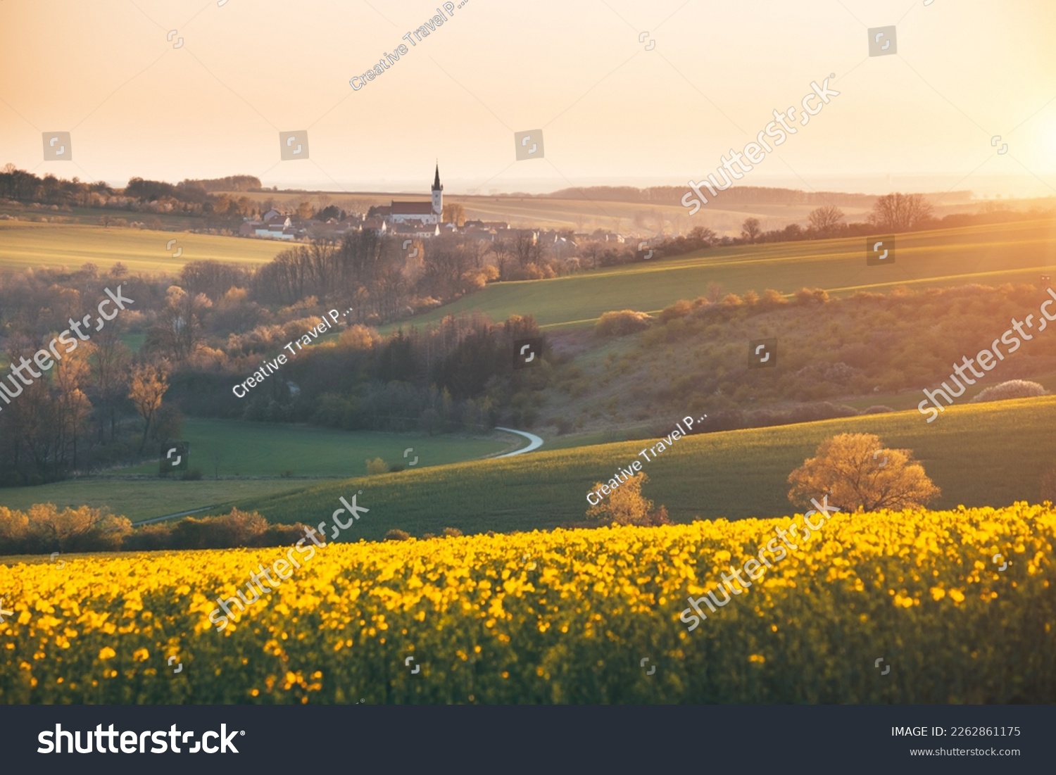Tranquil view on of sunlit wavy fields of agricultural area. Location place of South Moravia region, Czech Republic, Europe. Photo wallpaper. Image of an ecological district. Beauty of world. #2262861175