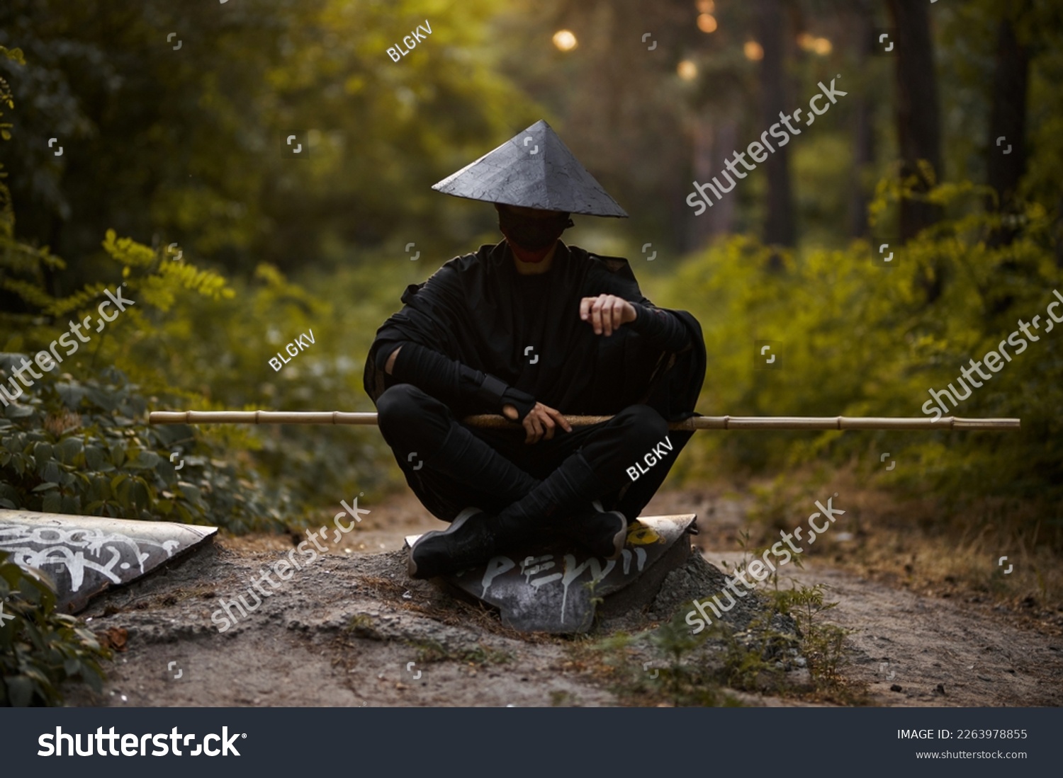 Surrealism theme: a man in a hannya mask, black kimono, black hat with a bamboo stick in his hands in the forest. Surreal image of a man in a hannya half mask, kimono. Surreal samurai, surreal ninja #2263978855