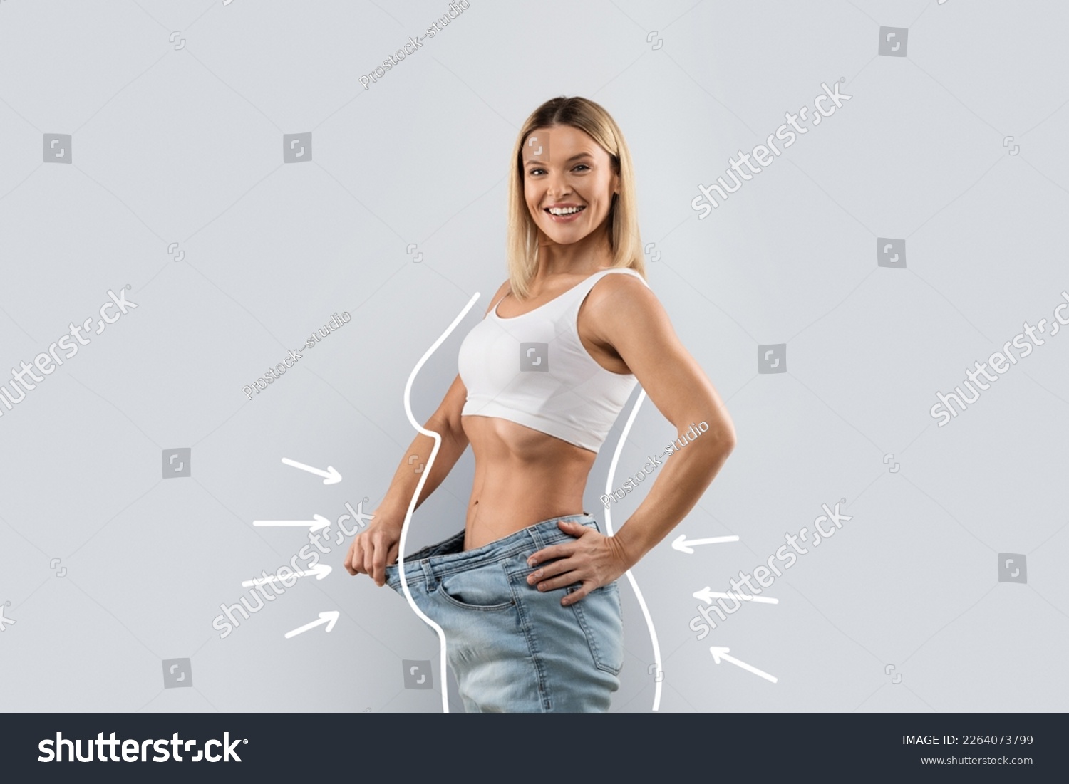 Happy positive middle aged pretty blonde lady wearing big jeans, showing loose in waist and smiling at camera, grey studio background, side view, copy space, collage #2264073799
