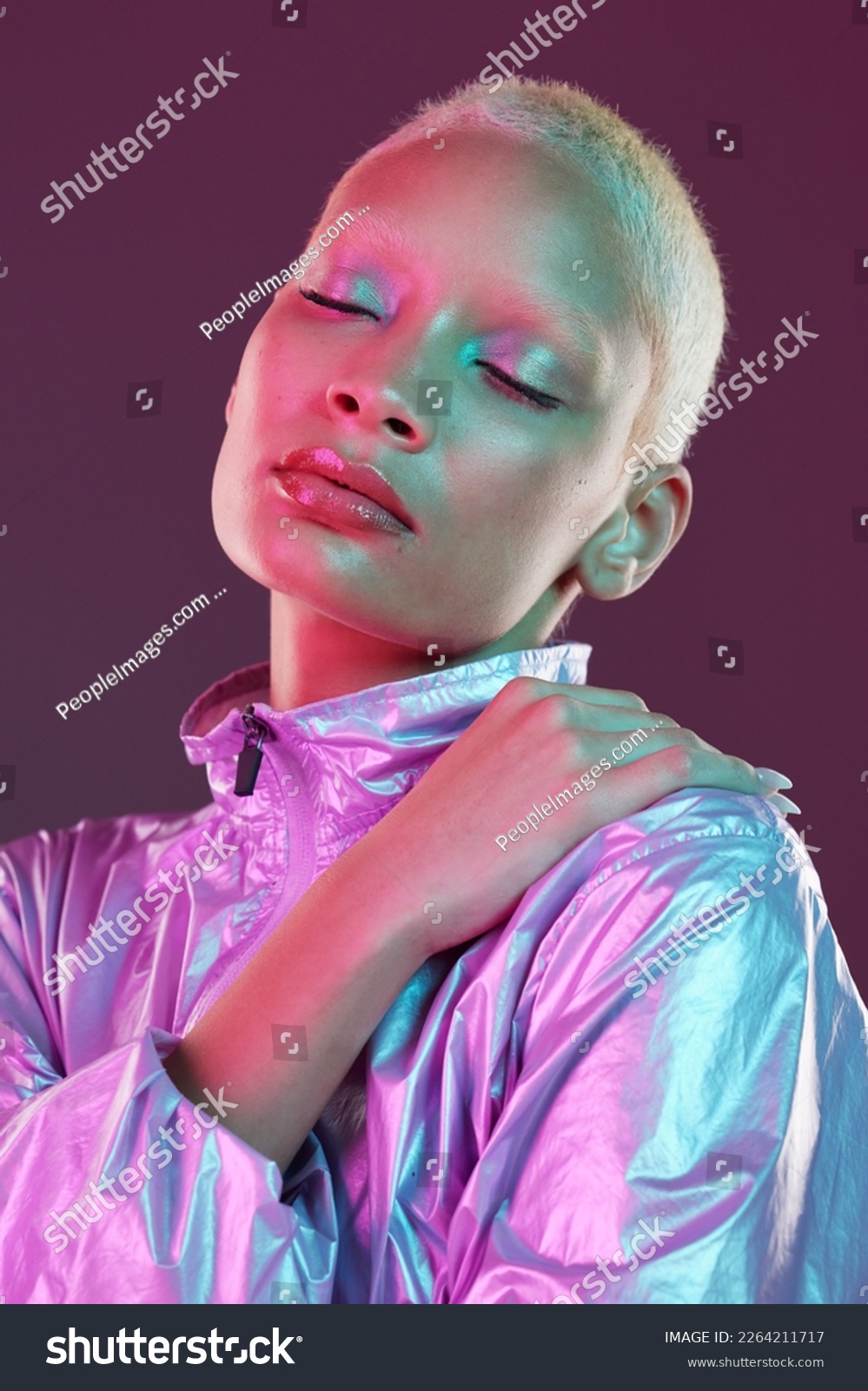 Holographic fashion, woman face and makeup glow for hologram trend isolated in studio. Futuristic, vaporwave and art color jacket on cyberpunk aesthetic model person for retro cosmetics shine on skin #2264211717