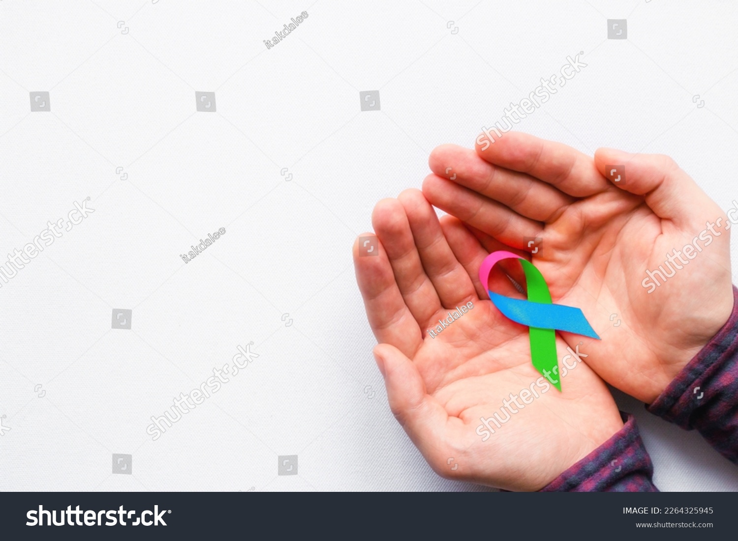 man holding a symbol of World AIDS Day #2264325945