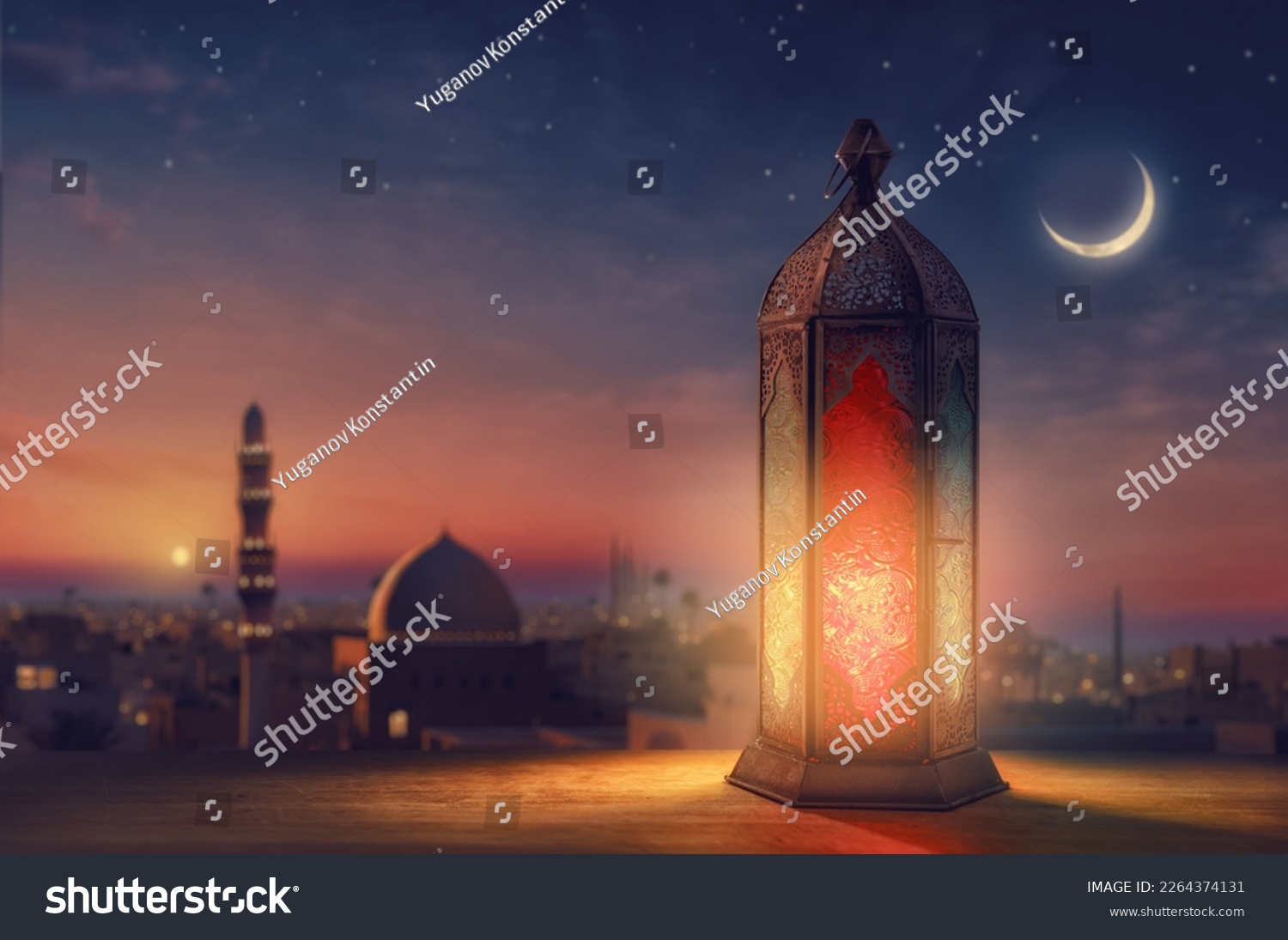 Ornamental Arabic lantern with burning candle glowing at night mosque background. Festive greeting card, invitation for Muslim holy month Ramadan Kareem. #2264374131
