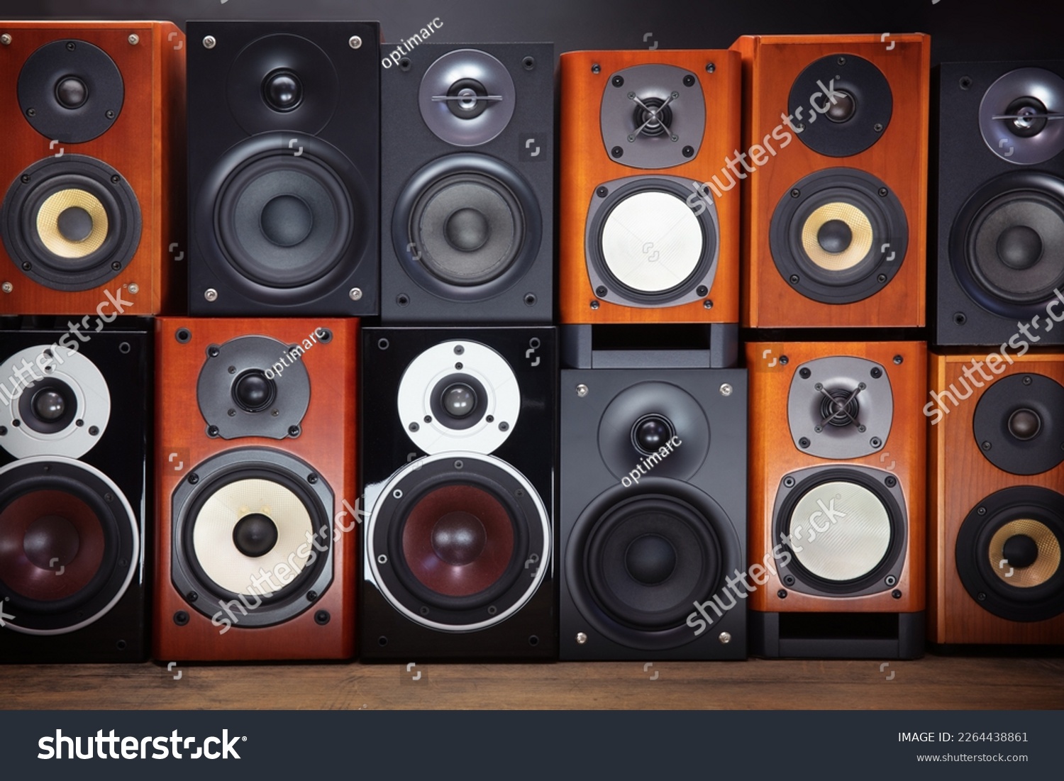 A wall of hi-fi audio speakers. Mid sized audio speakers or monitors stacked up. #2264438861