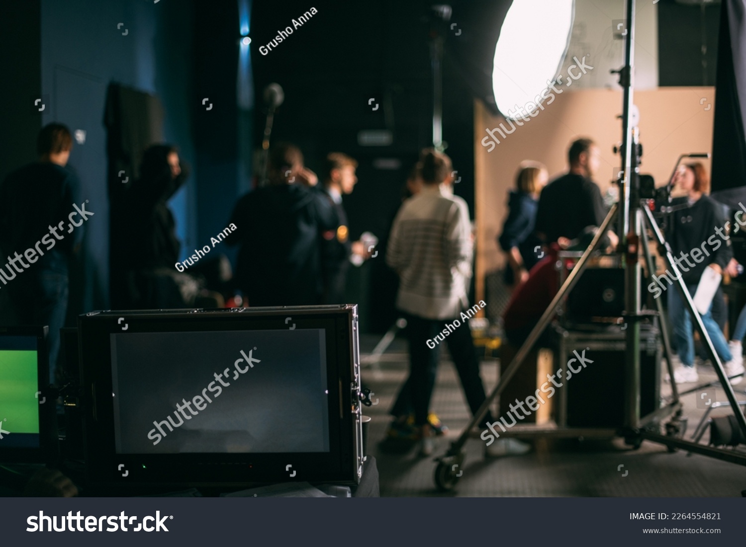Film set, monitors and modern shooting equipment. Film crew, lighting devices, monitors, playbacks - filming equipment and a team of specialists in filming movies, advertising and TV series #2264554821