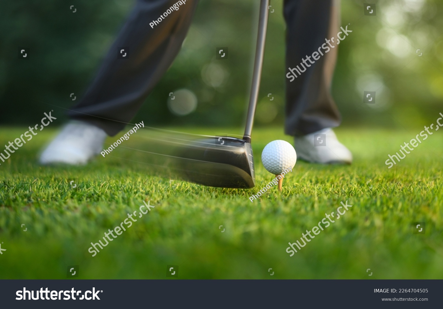 Motion action of teeing off golf ball with drivers. #2264704505