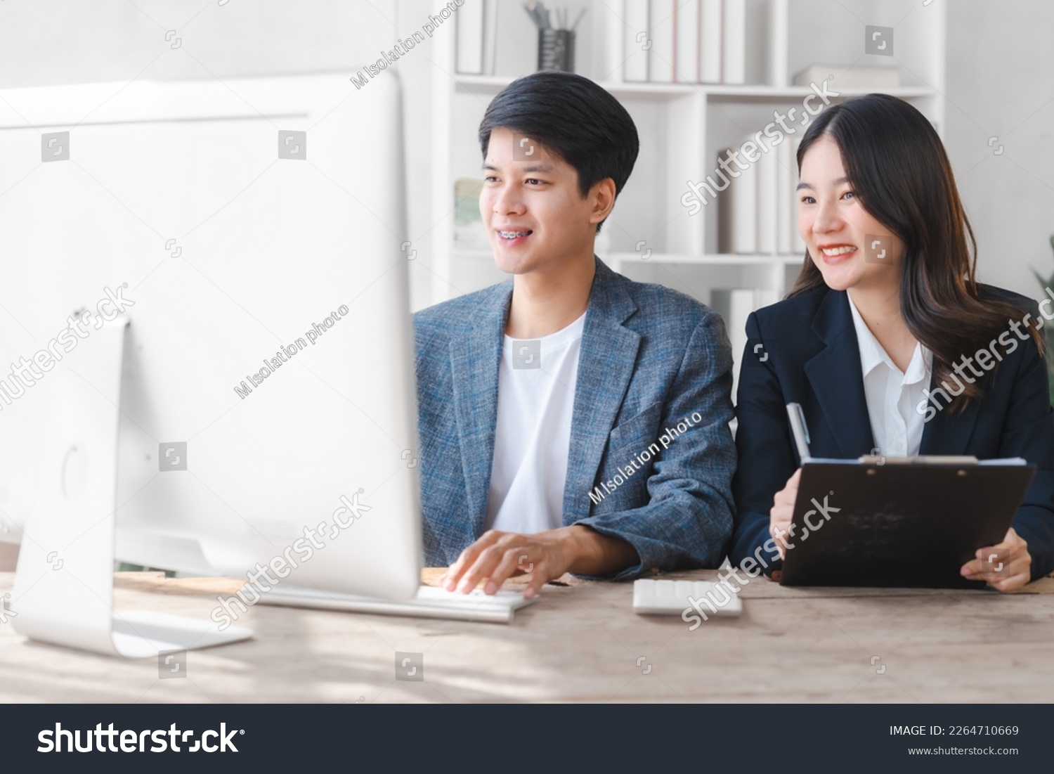 Two asia business person in formal suit working in office together , stock trader trading in computer together, bookkeepers working with online balance sheet, asset, profit or loss of limited company #2264710669