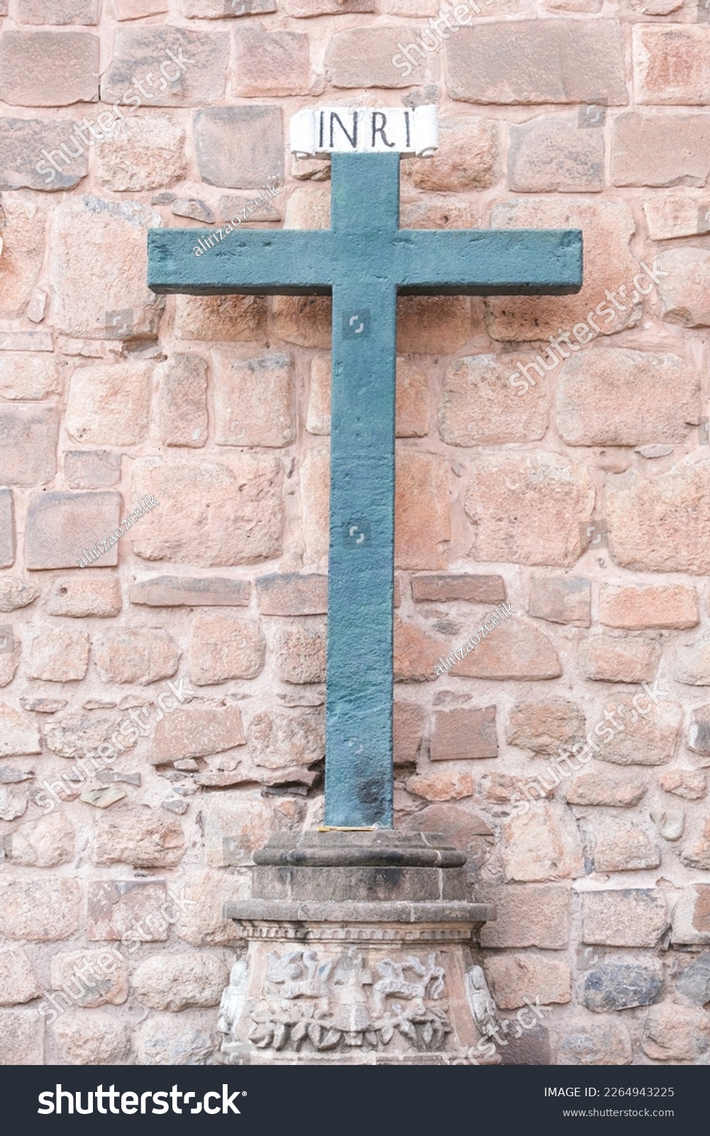 Inri christian cross symbol behind of catedral wall in Cusco Peru. Selective focus.  #2264943225
