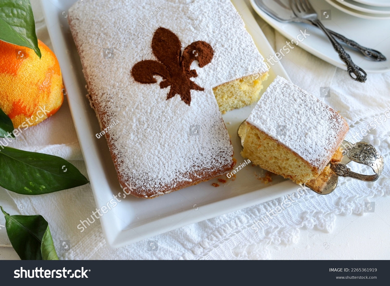 Schiacciata fiorentina, a carnival cake from Florence with orange flavor. Florentine lily on the cake sprinkled cocoa powder. Directly above. #2265361919