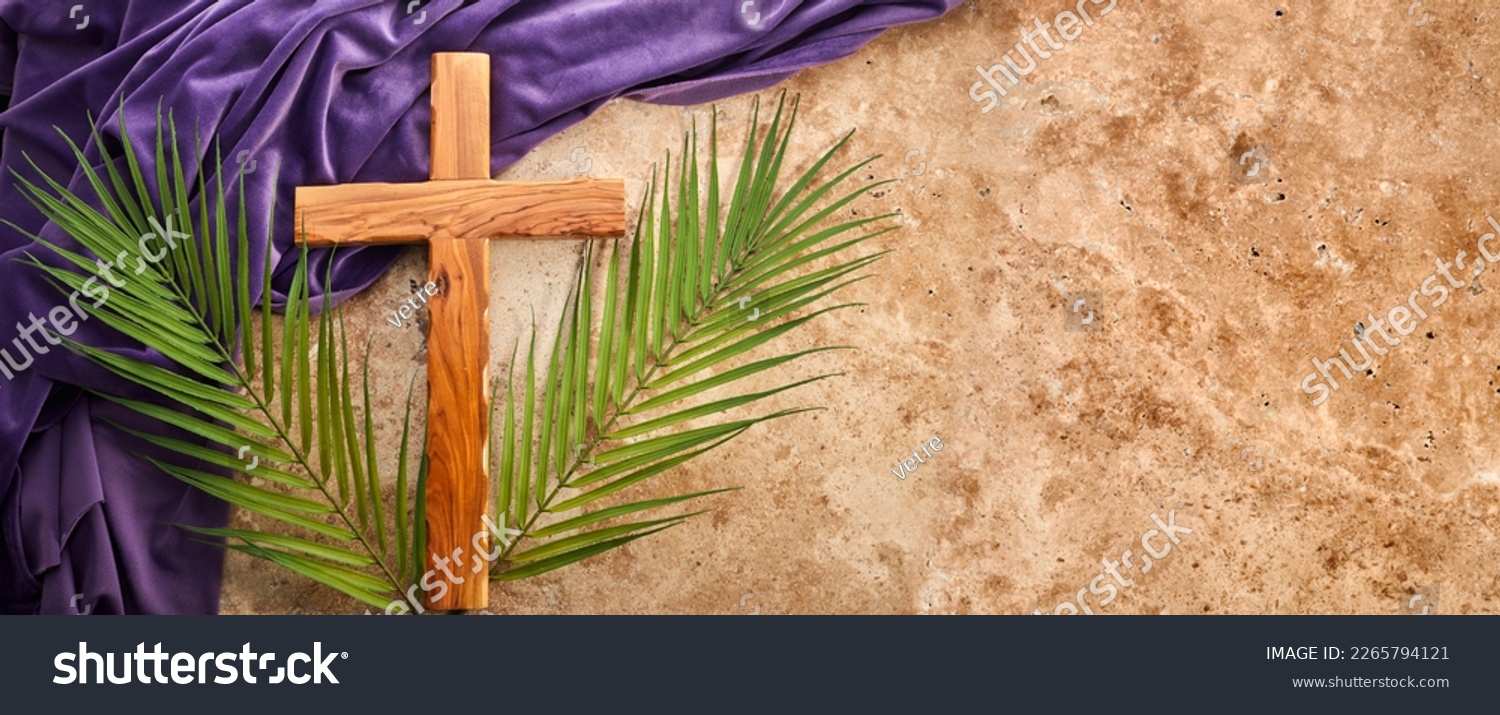 Lent season, Holy week and Good friday concept. Palm leave and cross on stone background #2265794121