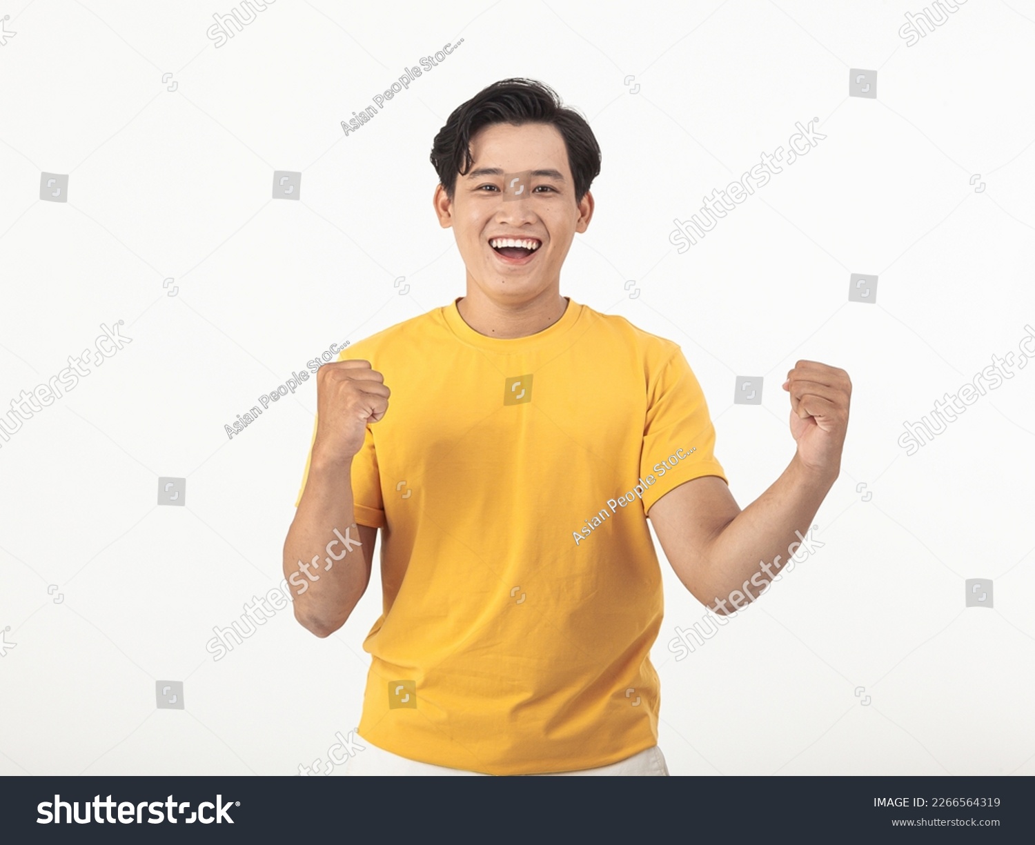 Portrait photo of a young happy cheerful handsome Asian man, yellow color casual wear, isolated on white background #2266564319
