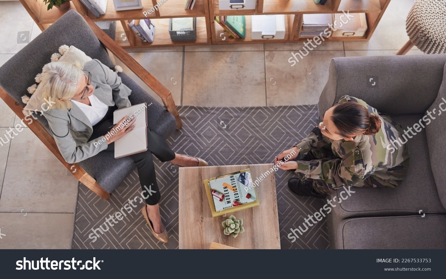 Therapy, support and military woman with psychologist talking about ptsd, mental health and stress from war. Psychology, above and veteran in communication with a therapist for consultation on trauma #2267533753