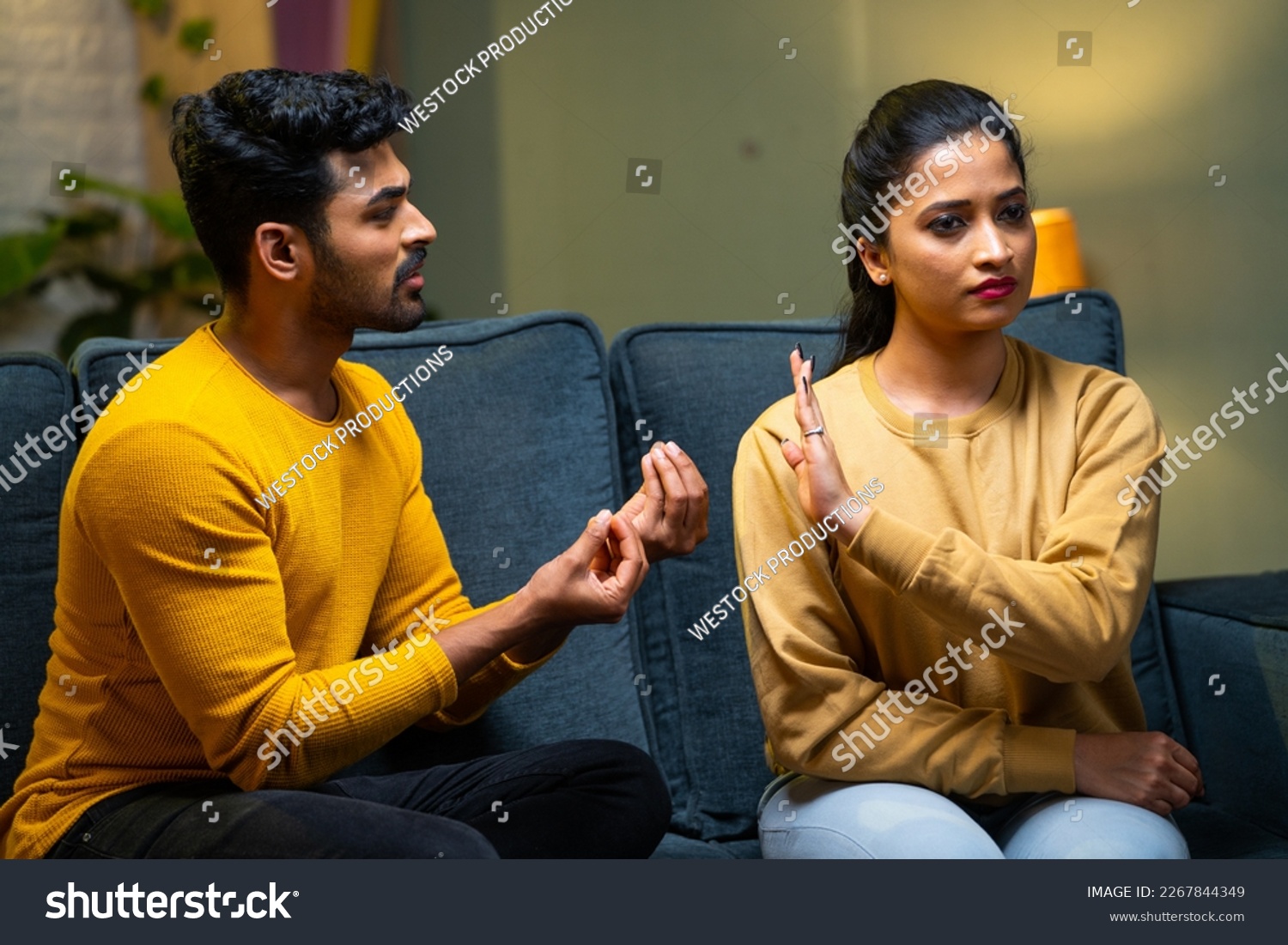 Girl or wife saying no husband trying to convince at home - concept of break up, conflict and disagreement #2267844349
