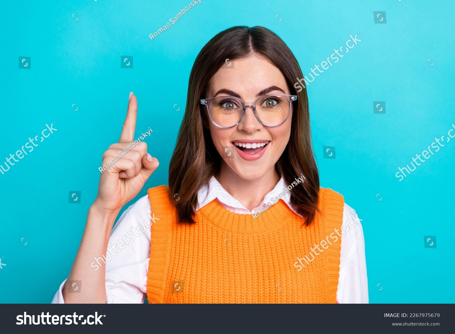 Photo of good mood funny cute clever woman with bob hairstyle orange waistcoat raise finger up good idea isolated on teal color background #2267975679