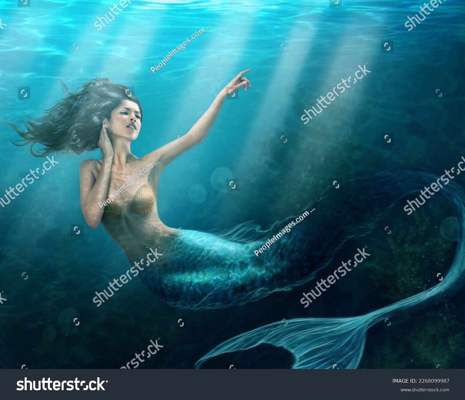 Siren of the sea. Shot of a mermaid swimming in solitude in the deep blue sea - ALL design on this image is created from scratch by Yuri Arcurs team of professionals for this particular photo shoot. #2268099987