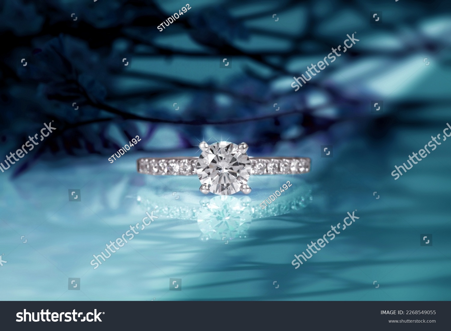 diamond engagement ring on abstract color background #2268549055