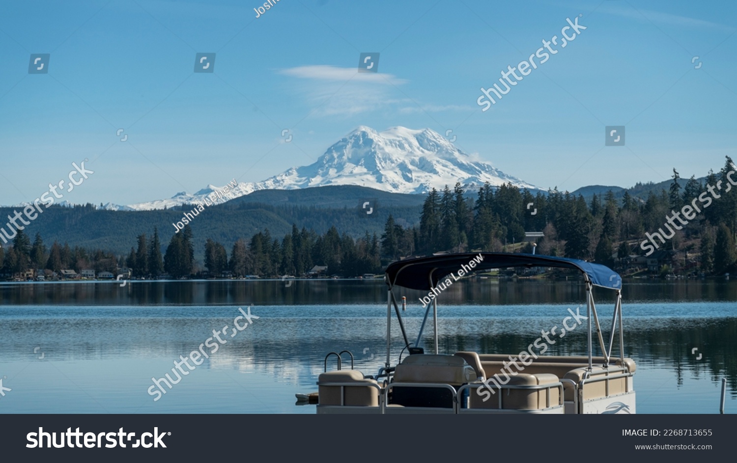 Clear lake and pontoon boat with Mount Rainier, Washington landscape in winter #2268713655