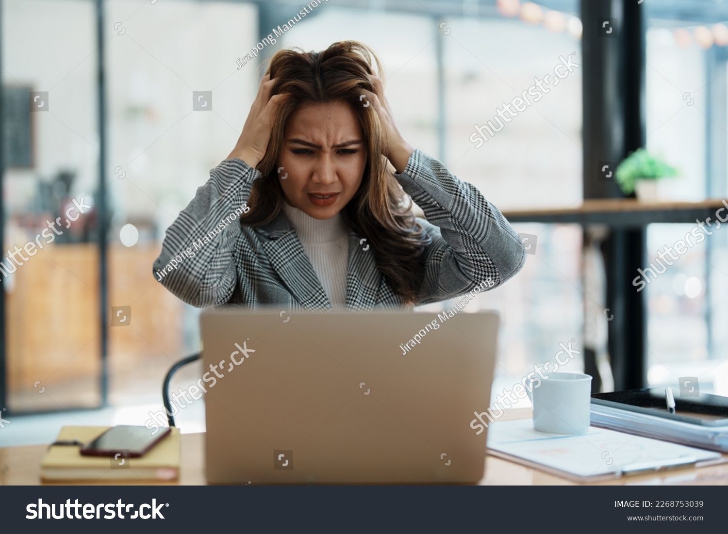 Portrait of business owner, woman using computer and financial statements Anxious expression on expanding the market to increase the ability to invest in business. #2268753039