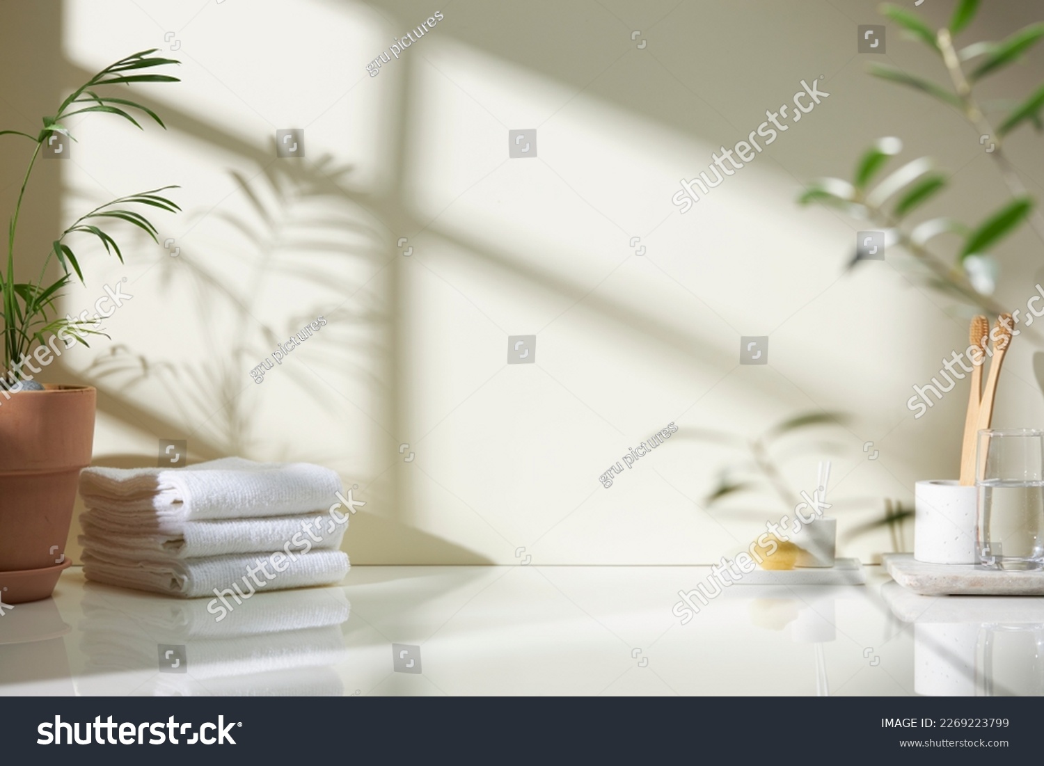 Various objects on a white tile background with warm sunlight shining through
 #2269223799