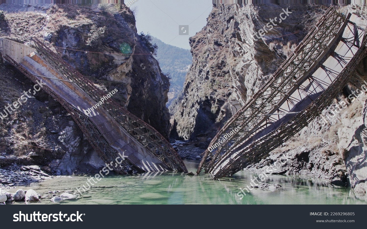 Beautiful image of collapsed bailey bridge in Himachal Pradesh, India. The main focus of the image is on collapsed bridge not hills at back drop. Re submission #2269296805