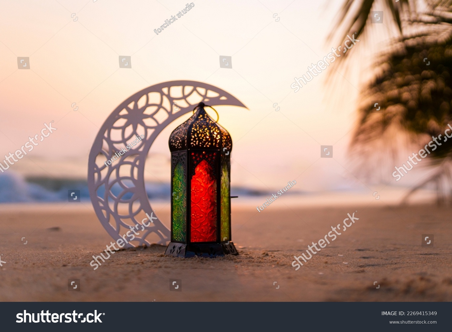 Eid Mubarak Lantern with crescent moon on the beach #2269415349