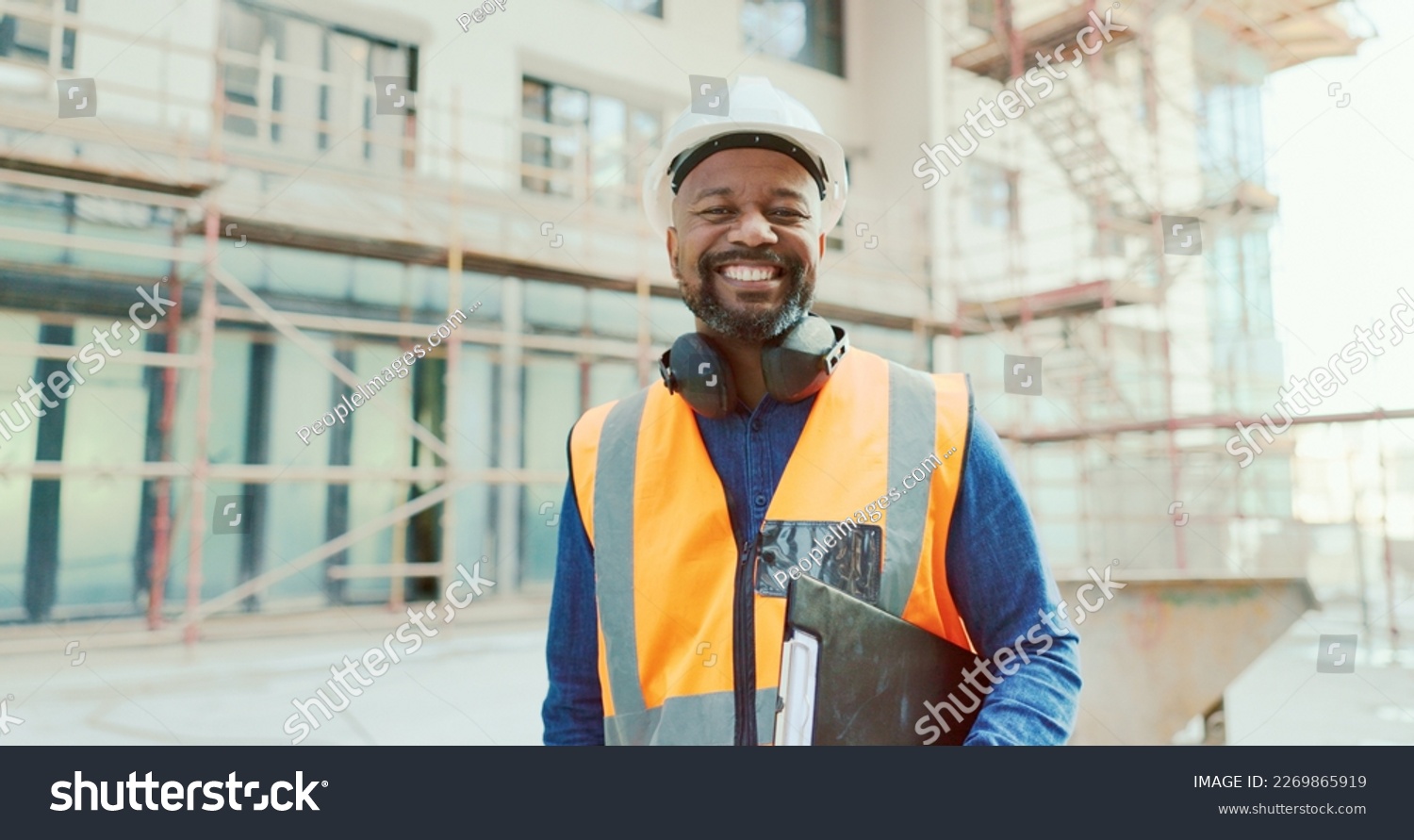 Construction, black man and clipboard, building and inspection, manage work at job site, construction worker and inspector smile in portrait. Engineer, builder and scaffolding for renovation. #2269865919