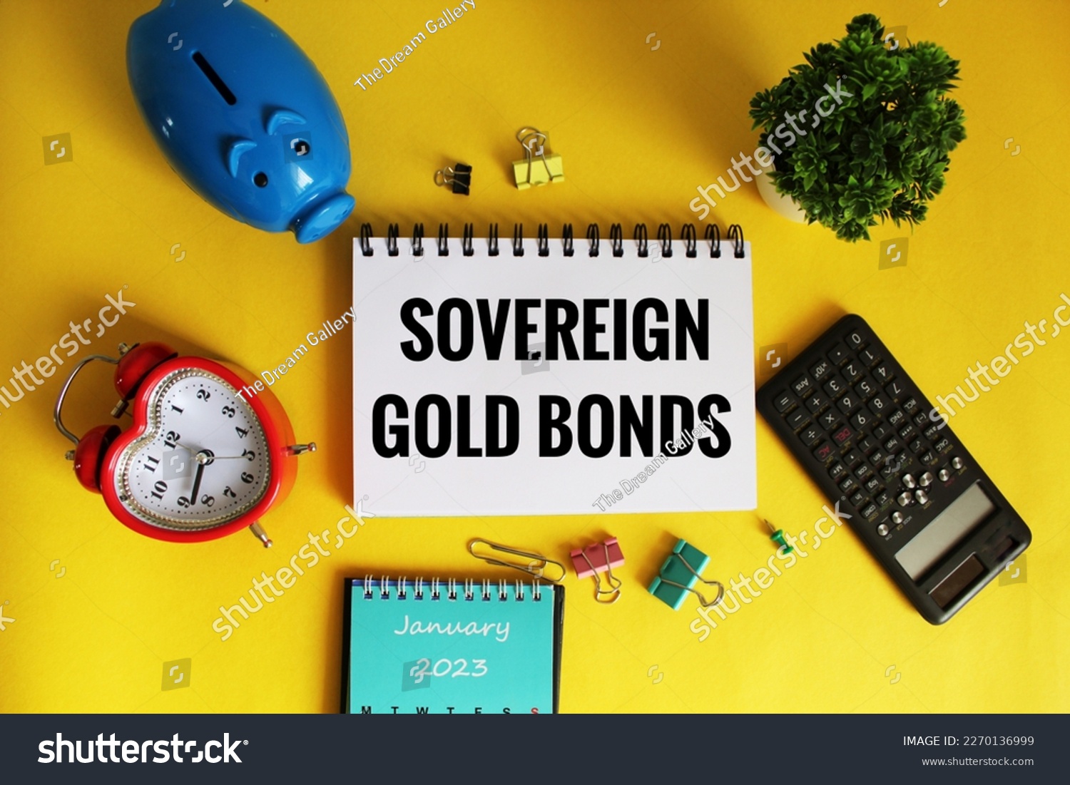 Sovereign gold Bonds Concept on open notepad on office wooden table with different stationery.  #2270136999