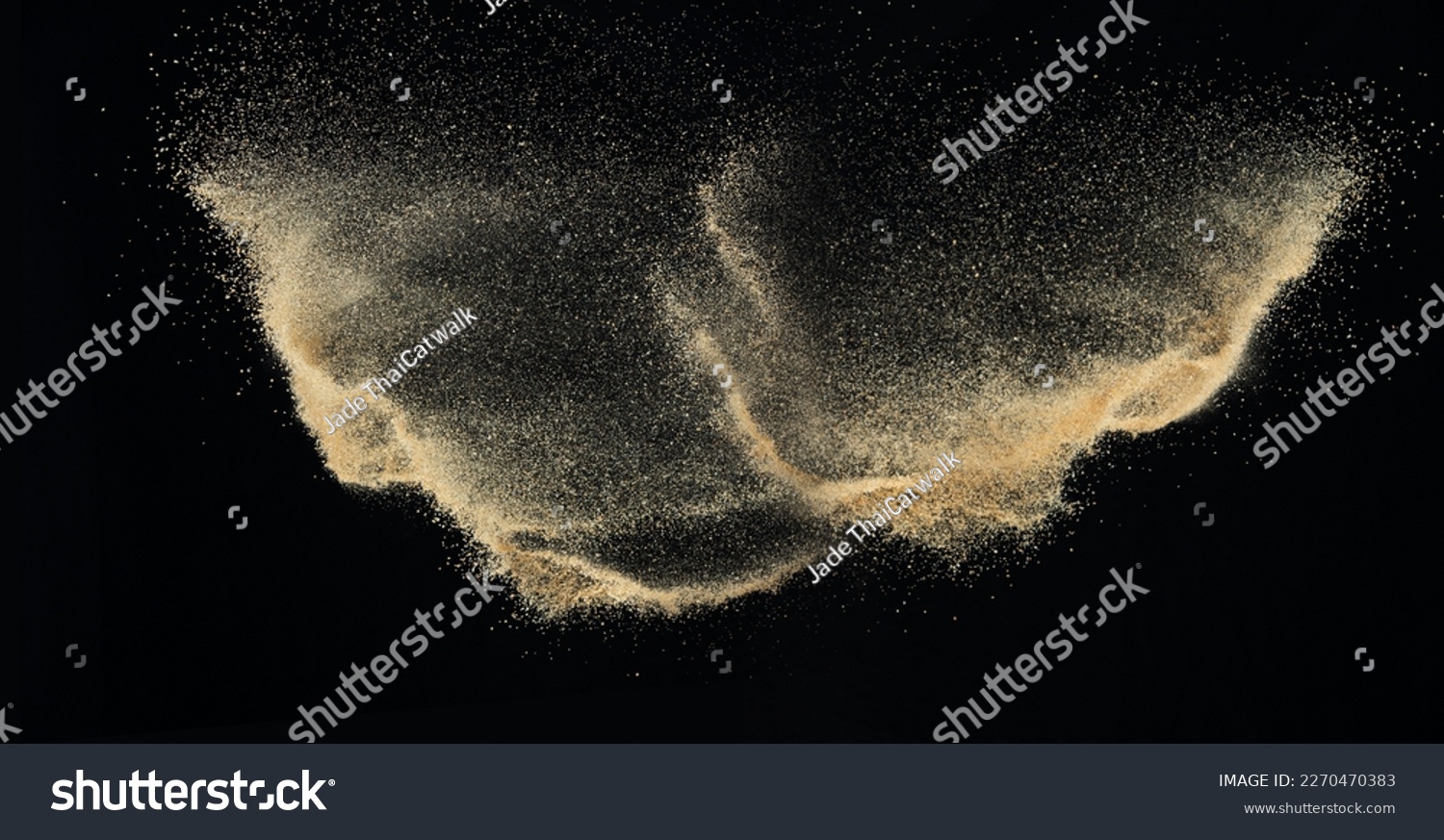 Sand flying explosion, Golden sand wave explode. Abstract sands cloud fly. Yellow colored sand splash throwing in Air. black background Isolated high speed shutter, throwing freeze stop motion #2270470383