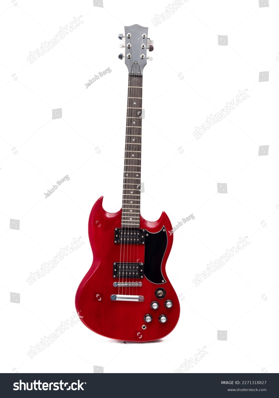 Red electric guitar isolated on white background. Musical instrument guitar. Close-up. #2271318827