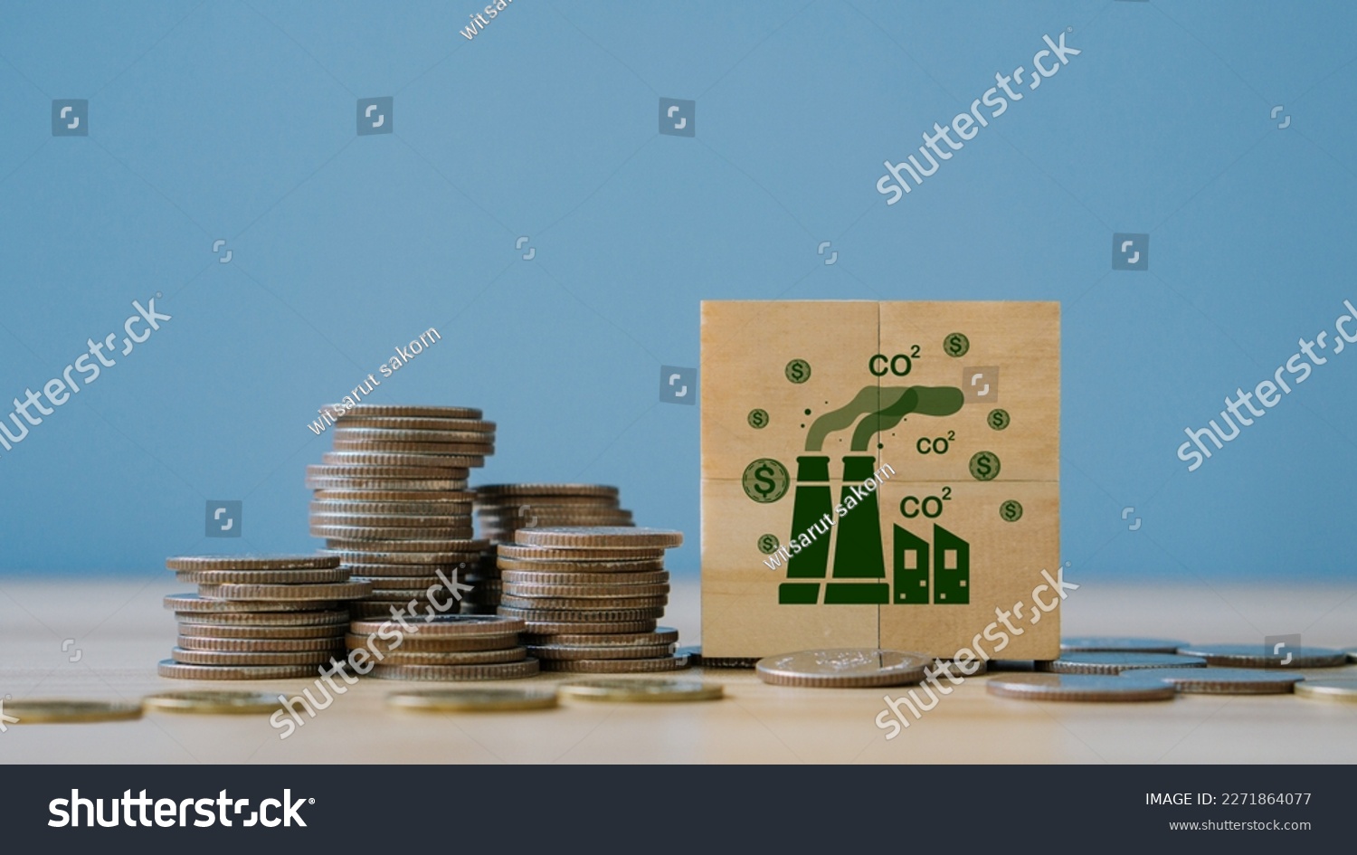 Concept of green Co2 Tax.Carbon tax, environmental and social responsibility business concept. Taxation for nature pollution.Wooden cubes with CO2 TAX word and stack coin. #2271864077