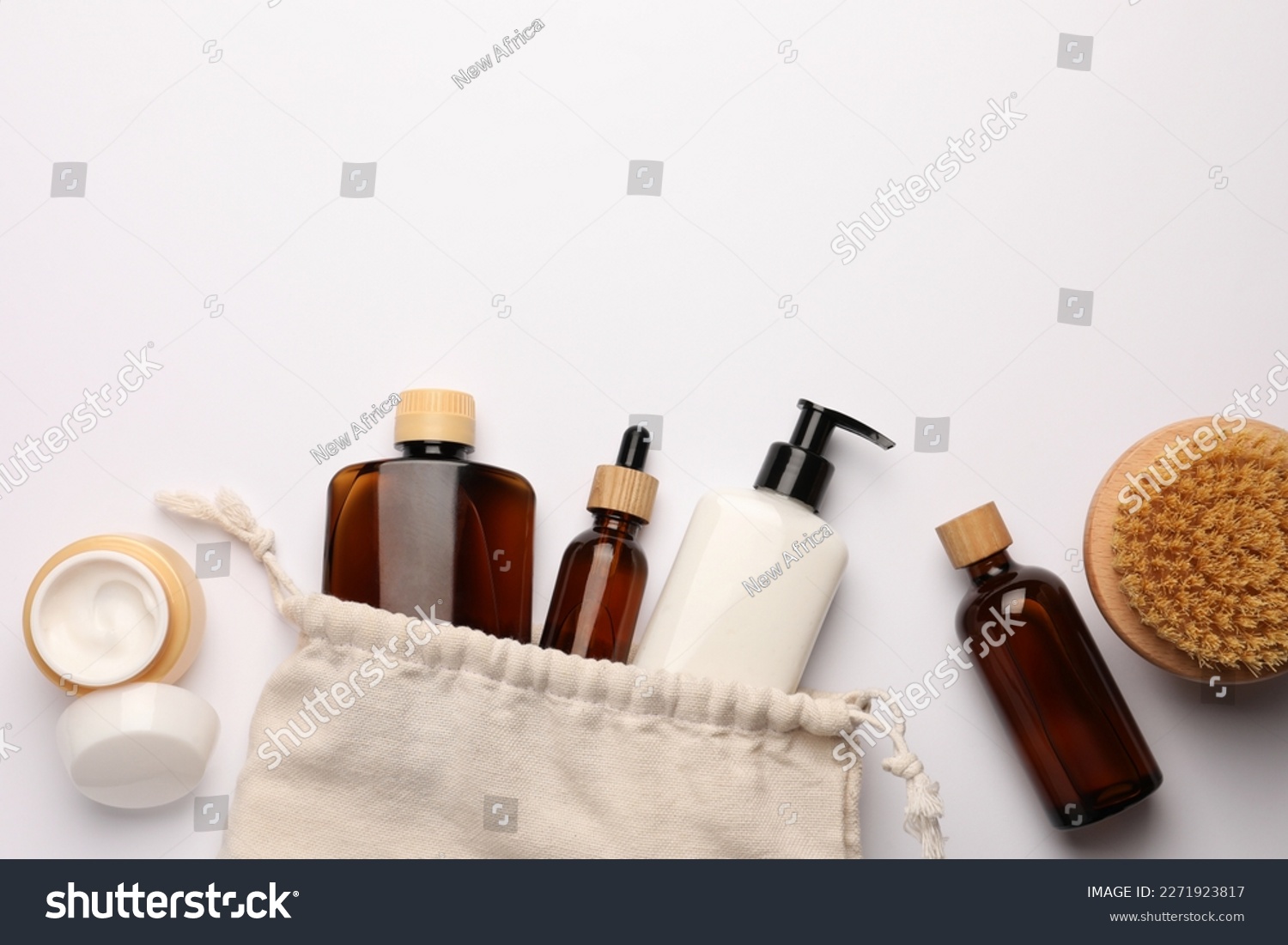 Preparation for spa. Compact toiletry bag and cosmetic products on white background, flat lay. Space for text #2271923817